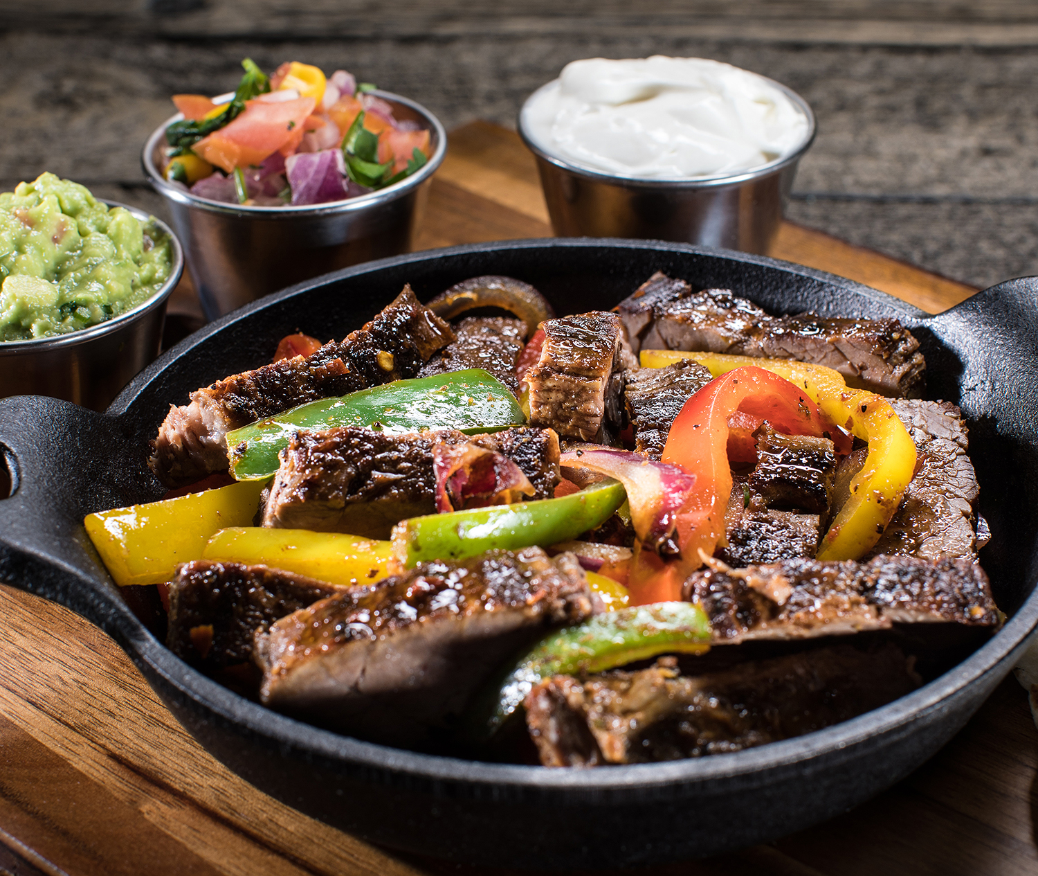 Order Carne Asada Steak Fajitas food online from Mixteco Mexican Grill store, Chicago on bringmethat.com