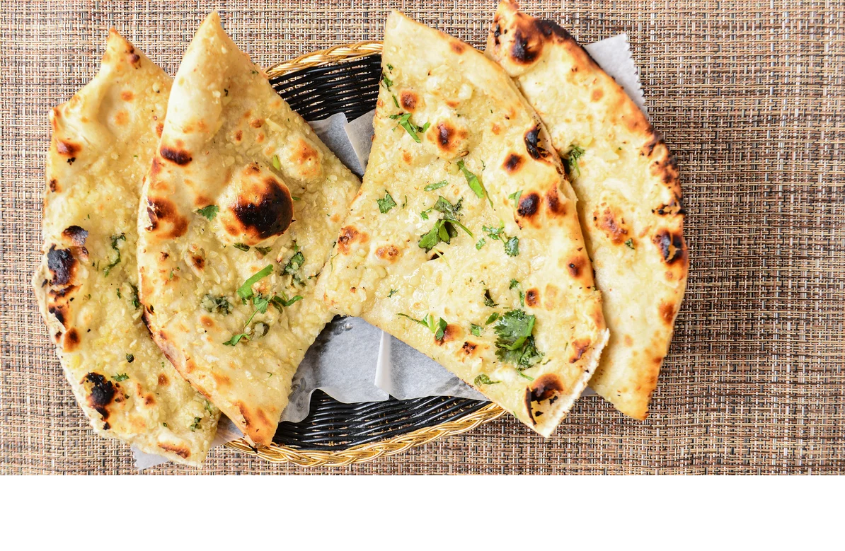 Order Garlic Naan food online from Hillside Indian Cuisine store, Portage on bringmethat.com