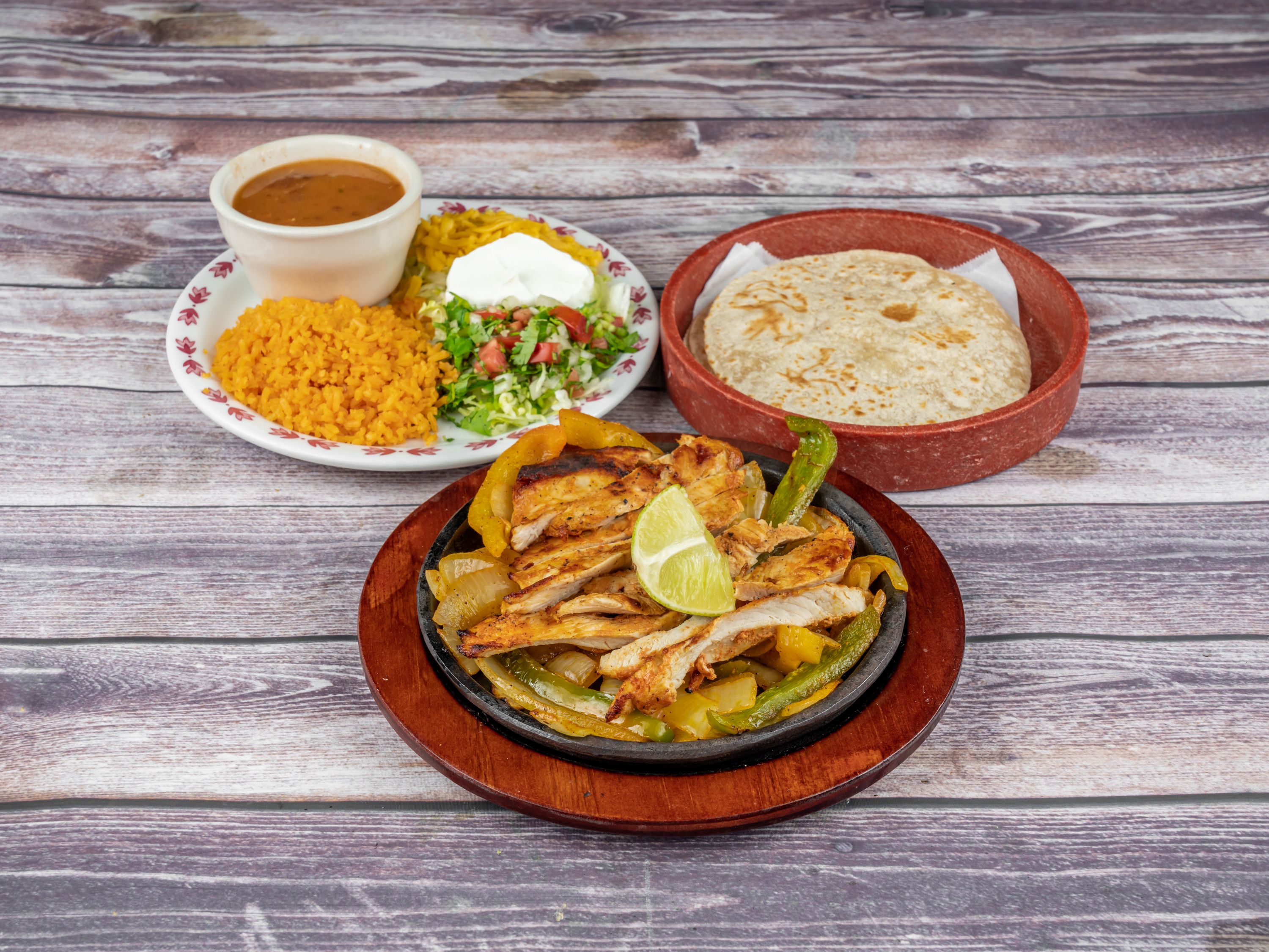 Order Fajitas Enchiladas food online from Tequila Lopez Mexican Restaurant store, Houston on bringmethat.com