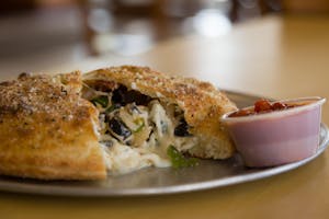 Order Deluxe Calzone food online from Massino's Pizzeria store, Aurora on bringmethat.com