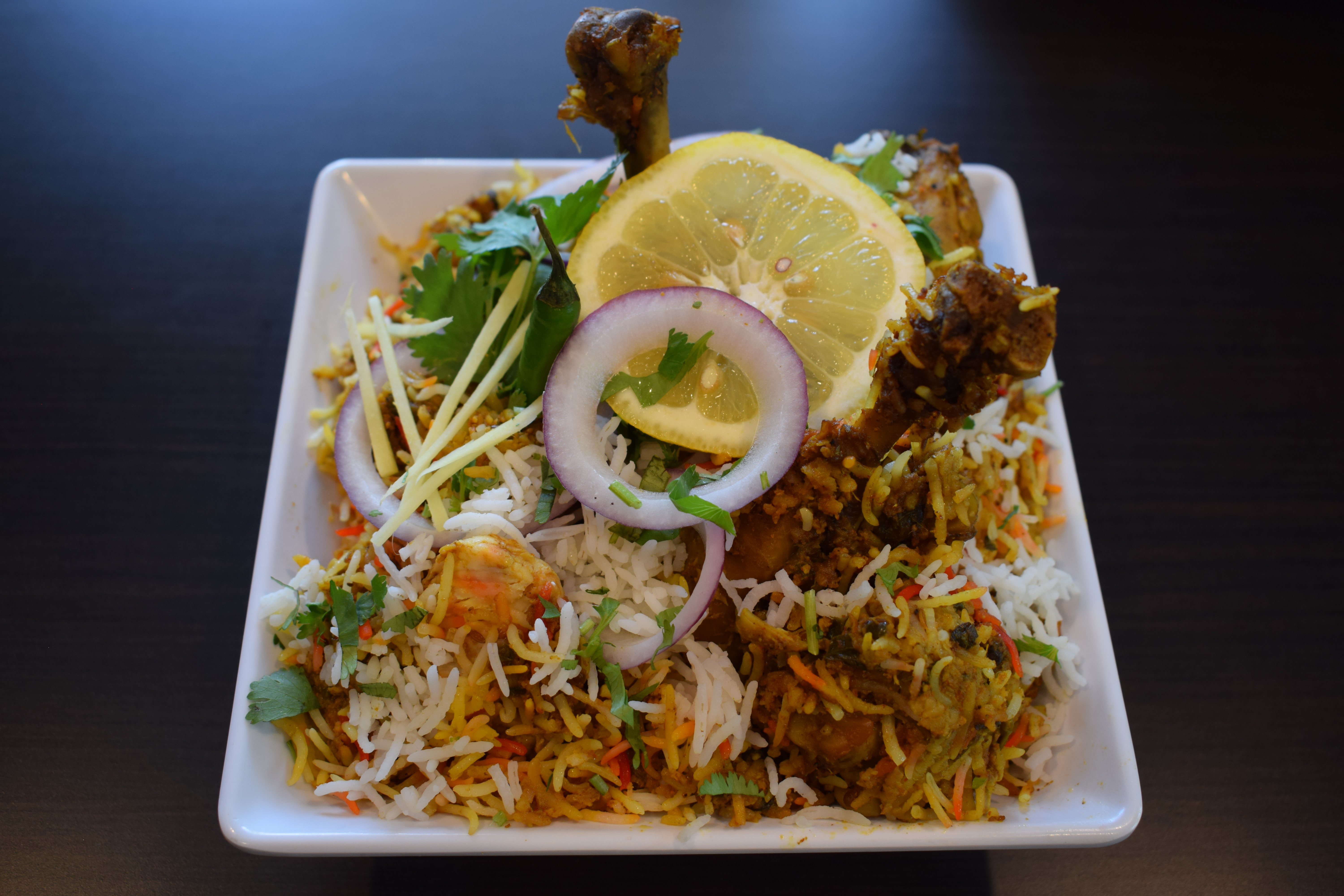Order North Indian Style Chicken Biryani food online from Crown Of India Restaurant store, Plainsboro on bringmethat.com