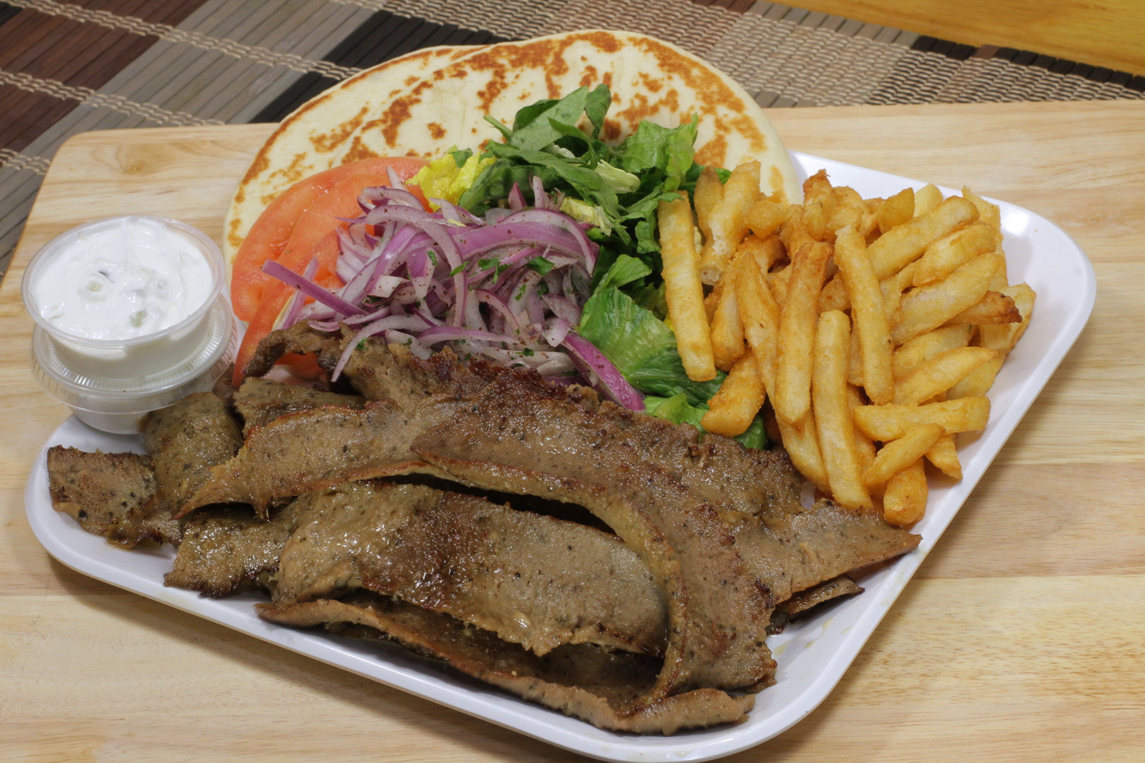 Order Gyros Plate with Fries food online from Fill A Pita store, Downers Grove on bringmethat.com