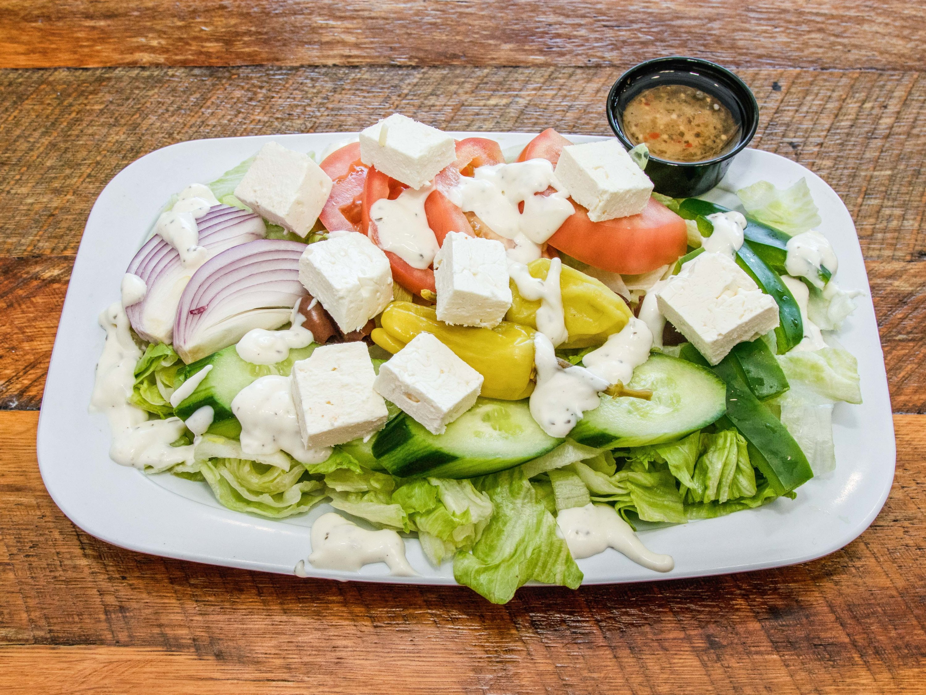 Order Greek Salad food online from Duccinis Pizza store, Falls Church on bringmethat.com