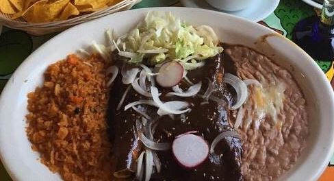Order 15. Enchiladas Mole Poblano food online from Hacienda Restaurant store, Highland Falls on bringmethat.com