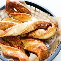 Order Garlic Parmesan Twists food online from Round Table Pizza store, Redondo Beach on bringmethat.com