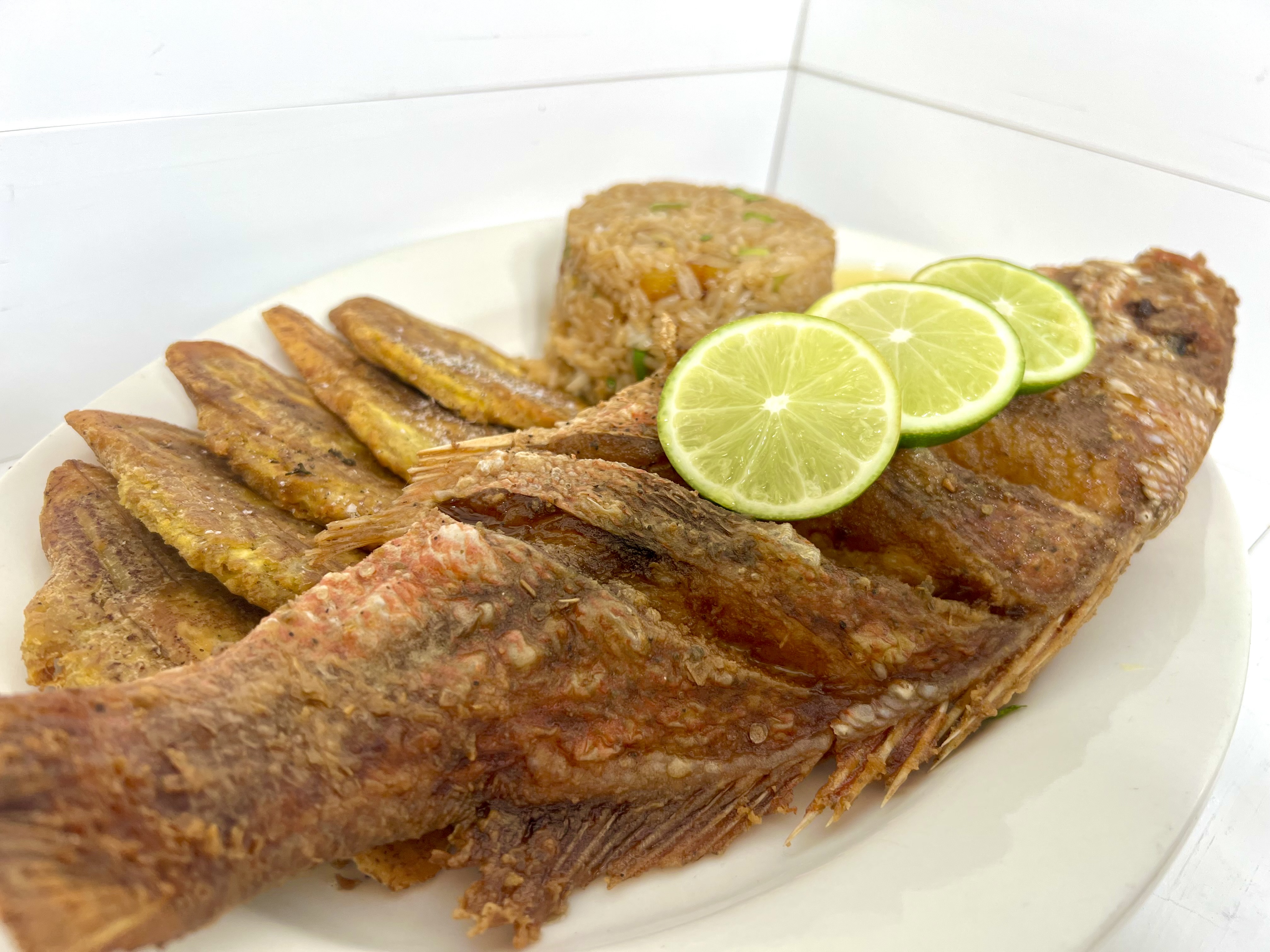 Order Crispy Whole Snapper with Caribbean Shrimp Fried Rice  food online from Mambo Empanadas store, Rutherford on bringmethat.com