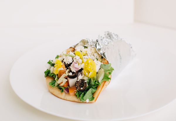 Order Greek Salad Pita food online from Nikos Pizza & Subs store, Baltimore on bringmethat.com