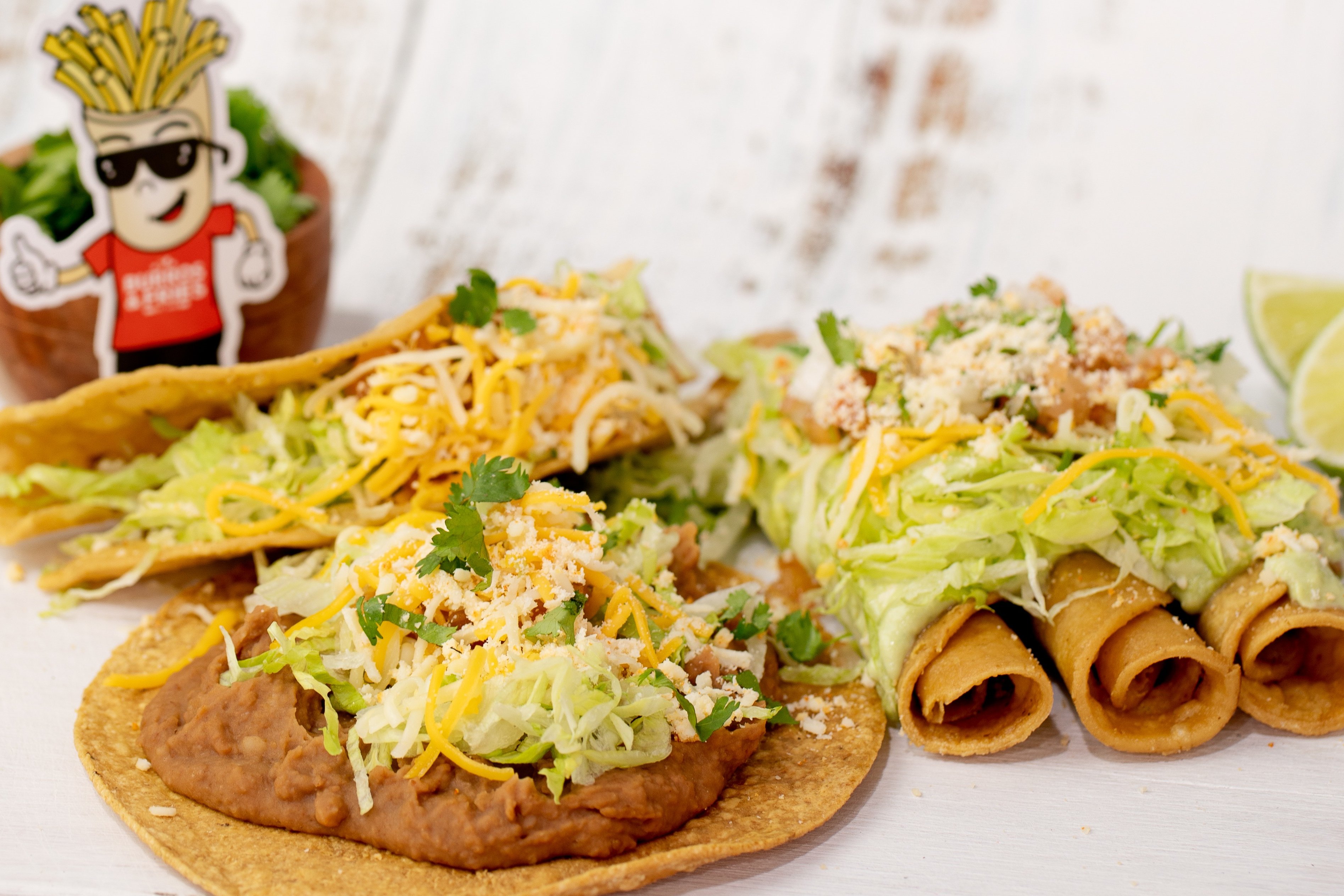 Order * 10 - Shredded Beef Taco, Bean Tostada + 3 Rolled Tacos food online from Burros & Fries store, Escondido on bringmethat.com