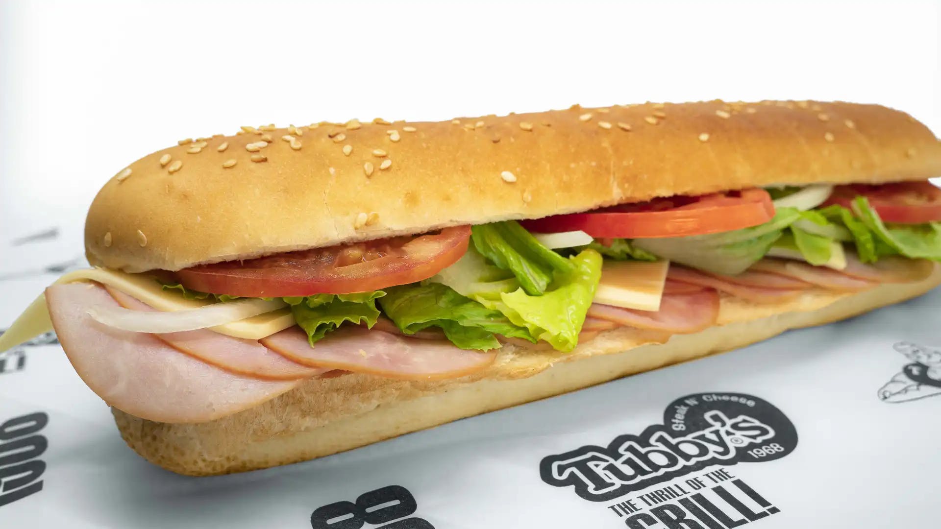 Order Ham & Cheese Sub - Small food online from Tubby's Grilled Submarines store, Westland on bringmethat.com