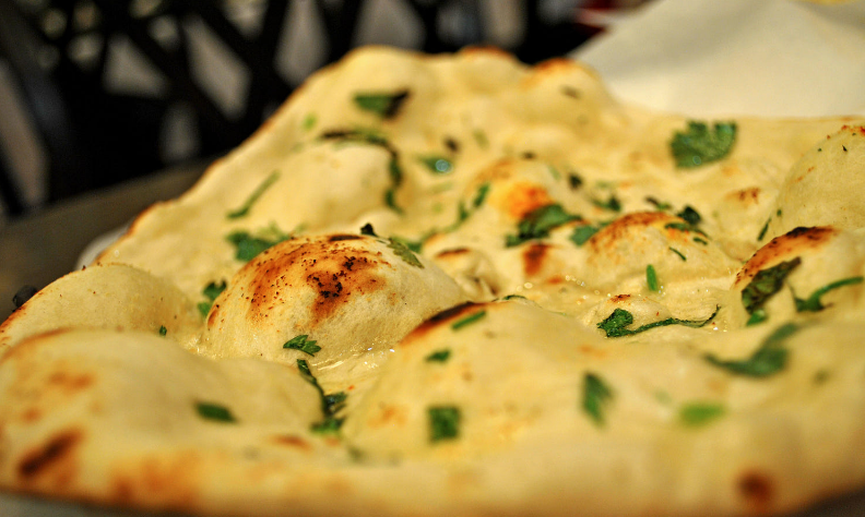 Order Garlic Naan food online from Spicelife Indian Fare store, Gaithersburg on bringmethat.com