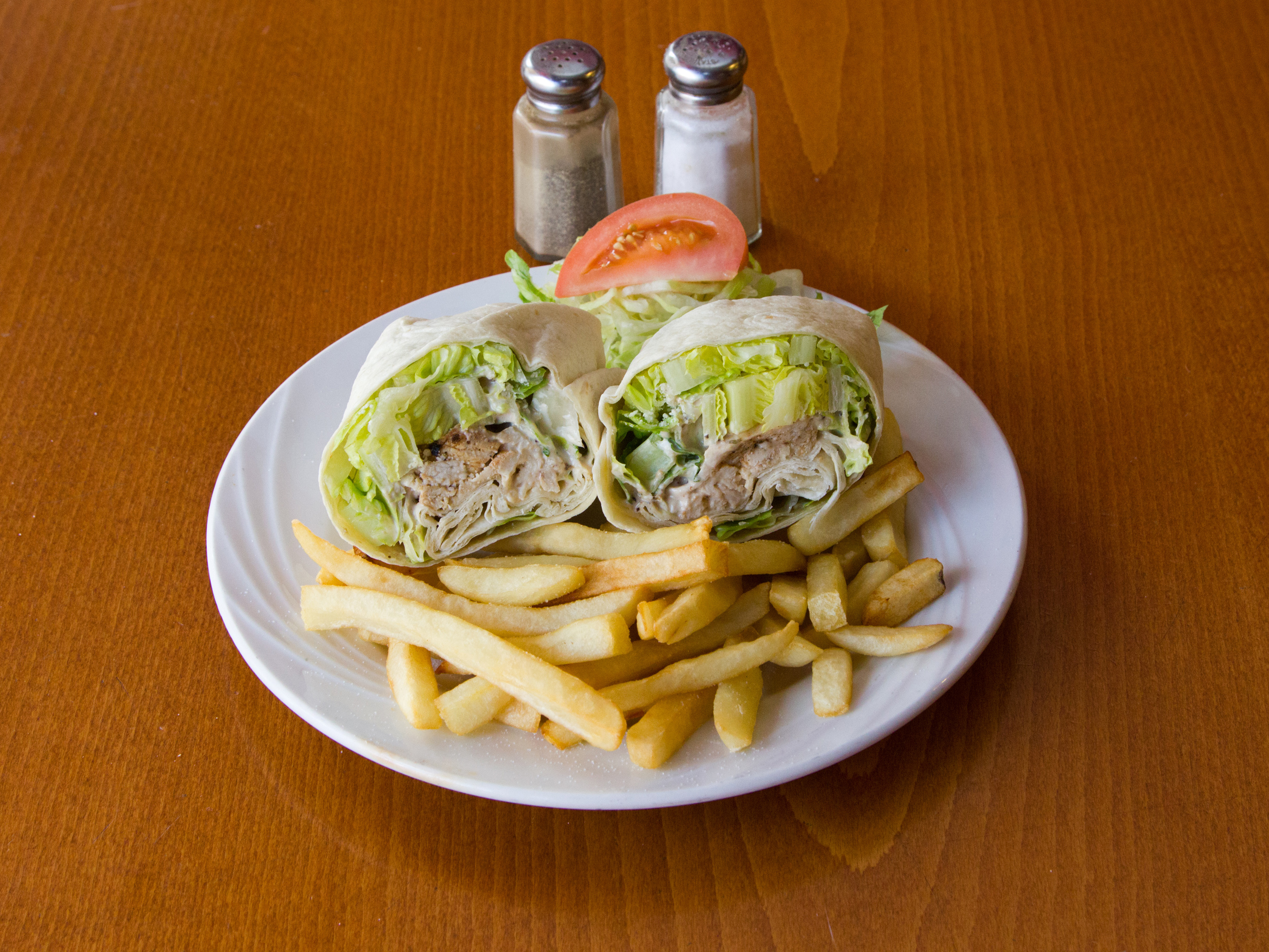 Order Grilled Chicken Caesar Wrap food online from Peppino's Pizza store, Kearny on bringmethat.com