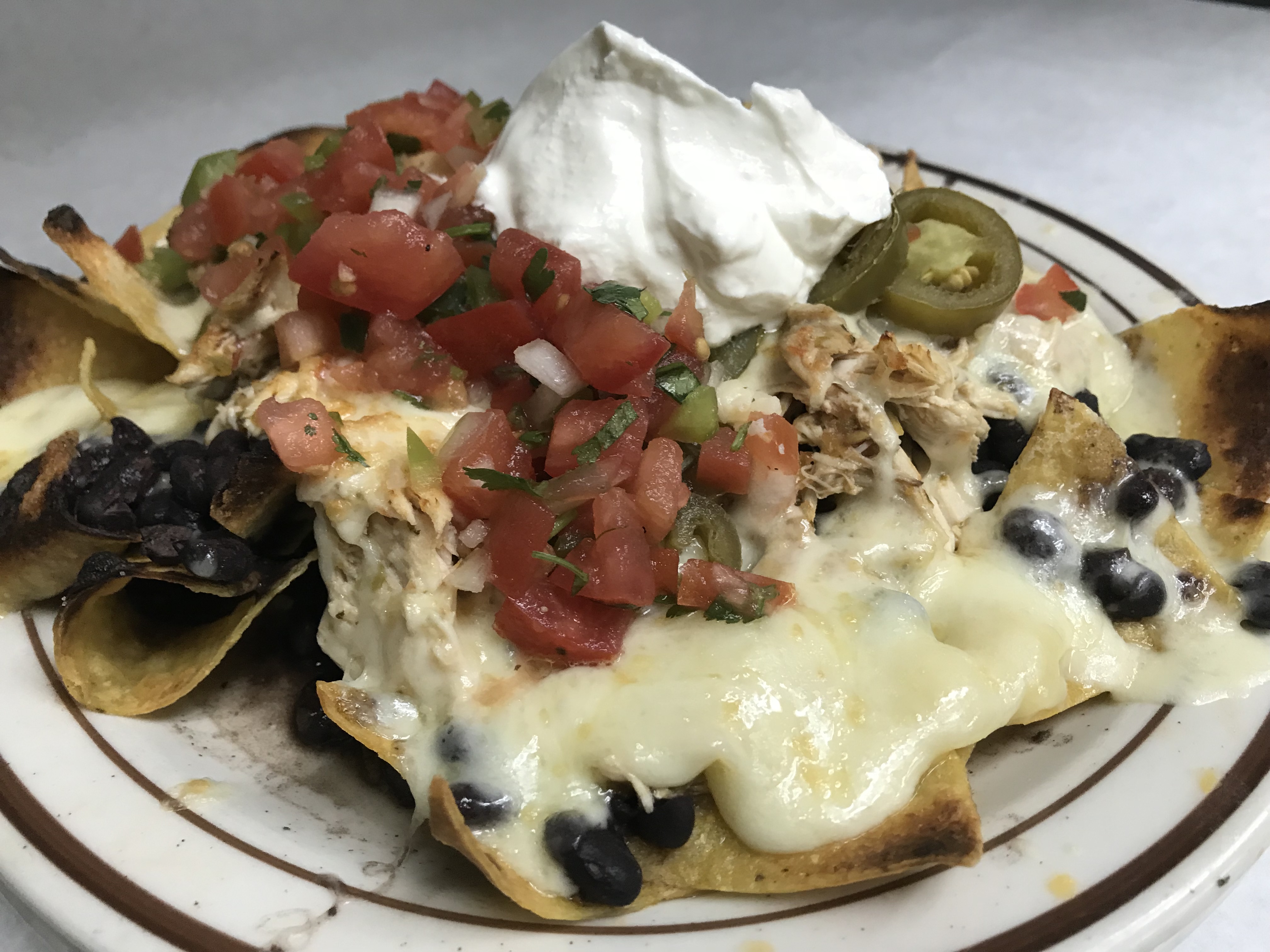 Order Nachos food online from Cowgirl store, New York on bringmethat.com