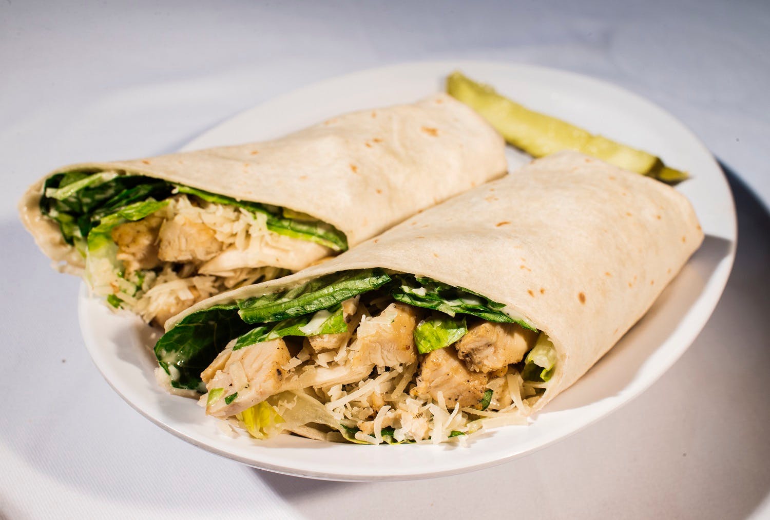 Order Chicken Caesar Wrap - Wrap food online from Rudino's Pizza & Grinders store, Knightdale on bringmethat.com