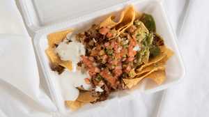 Order Regular Nachos with Meat food online from Taqueria San Jose store, Modesto on bringmethat.com