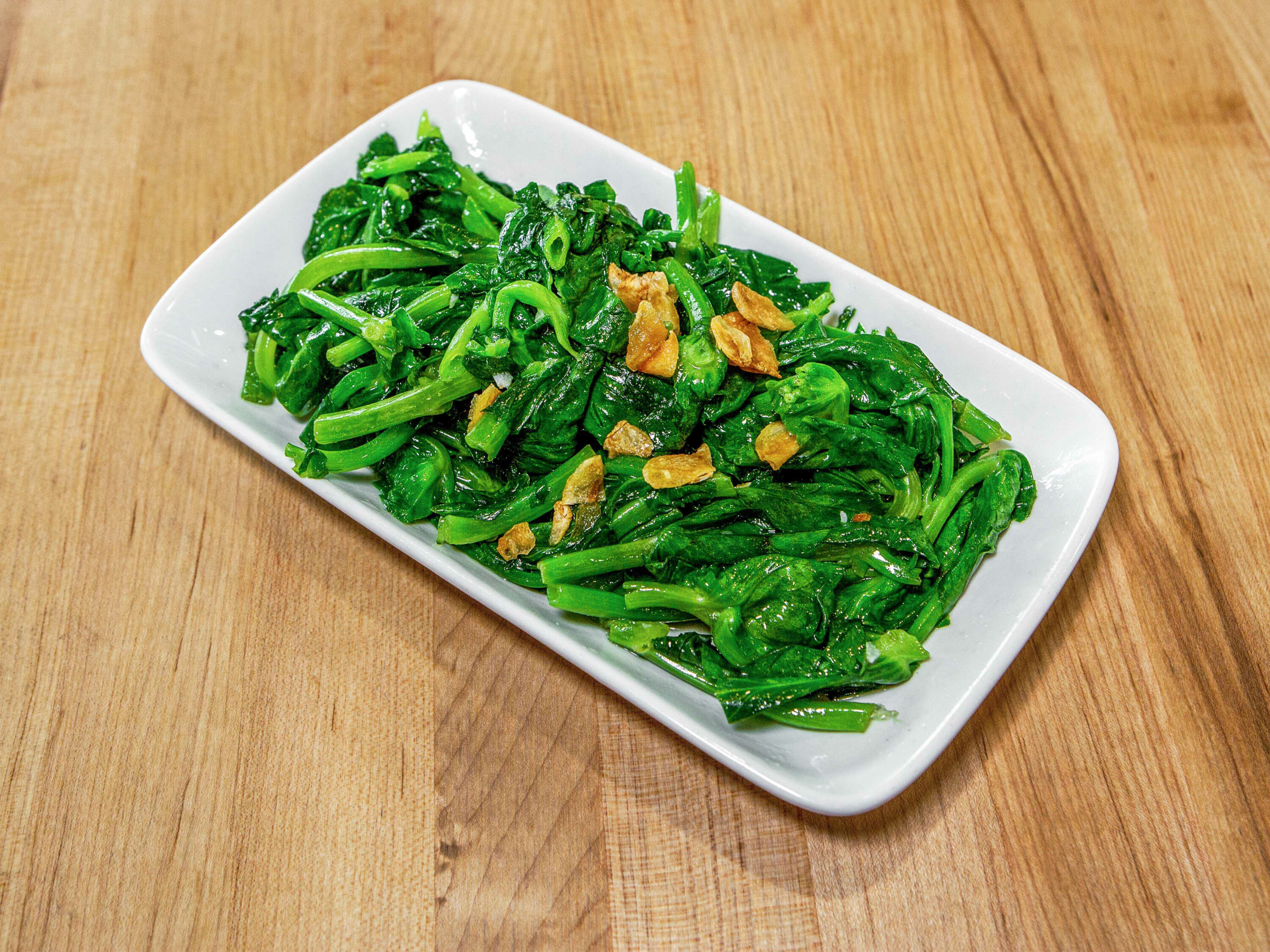 Order snow pea leaves with garlic food online from Dan Modern Chinese store, Manhattan Beach on bringmethat.com