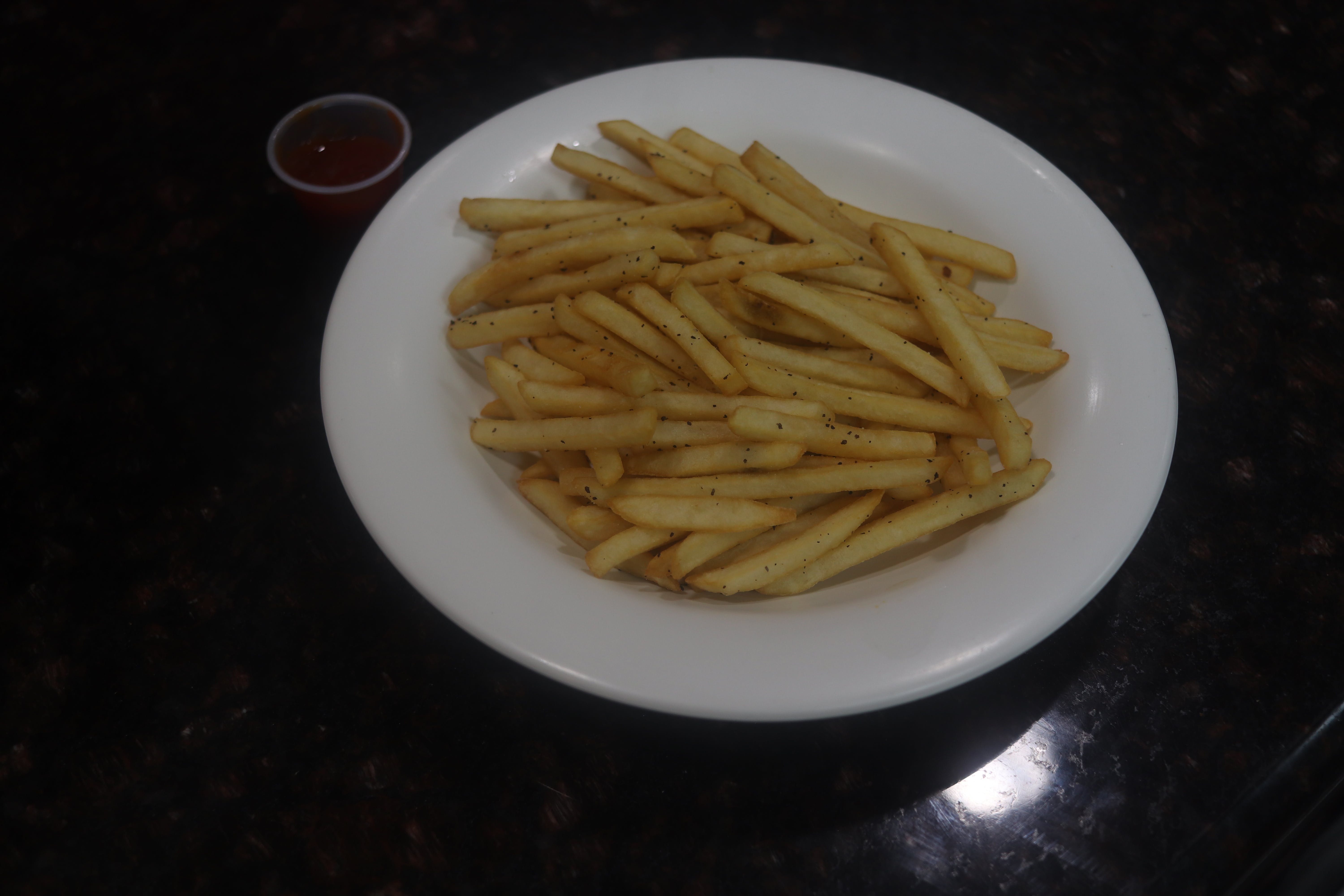 Order French Fries - Side food online from The Village Grille store, Great Falls on bringmethat.com