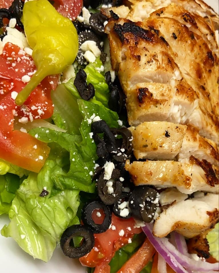 Order Greek Salad food online from World Famous Grill store, Bell Gardens on bringmethat.com