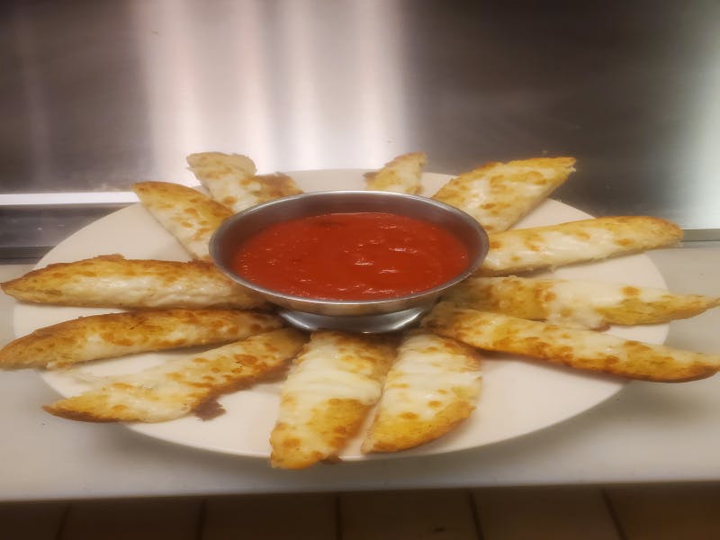 Order Garlic Bread Sticks with Cheese - Appetizer food online from Pizza Leone store, Fairfield on bringmethat.com