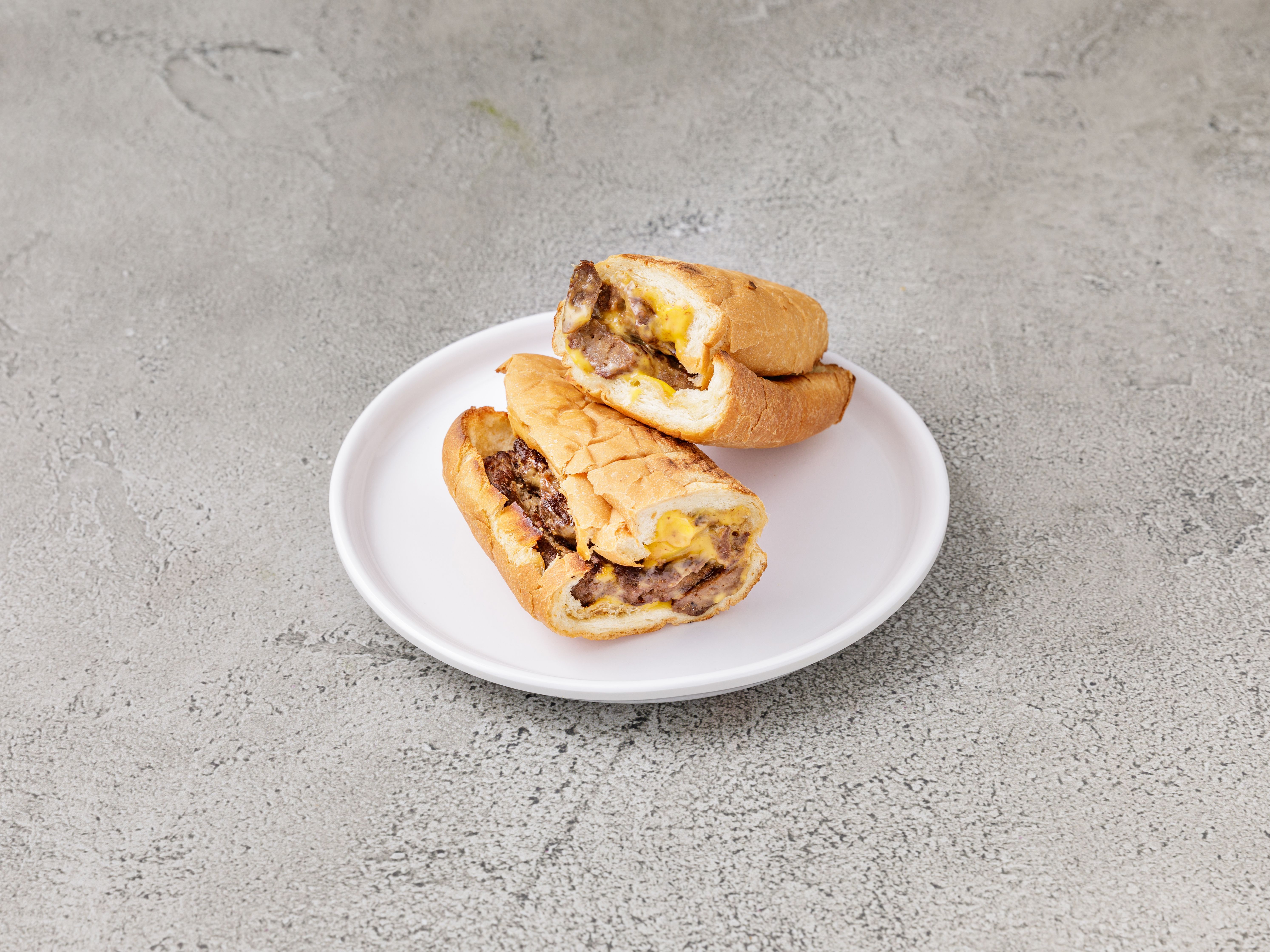 Order Cheeseburger Sub food online from Philly's Best store, Baltimore on bringmethat.com