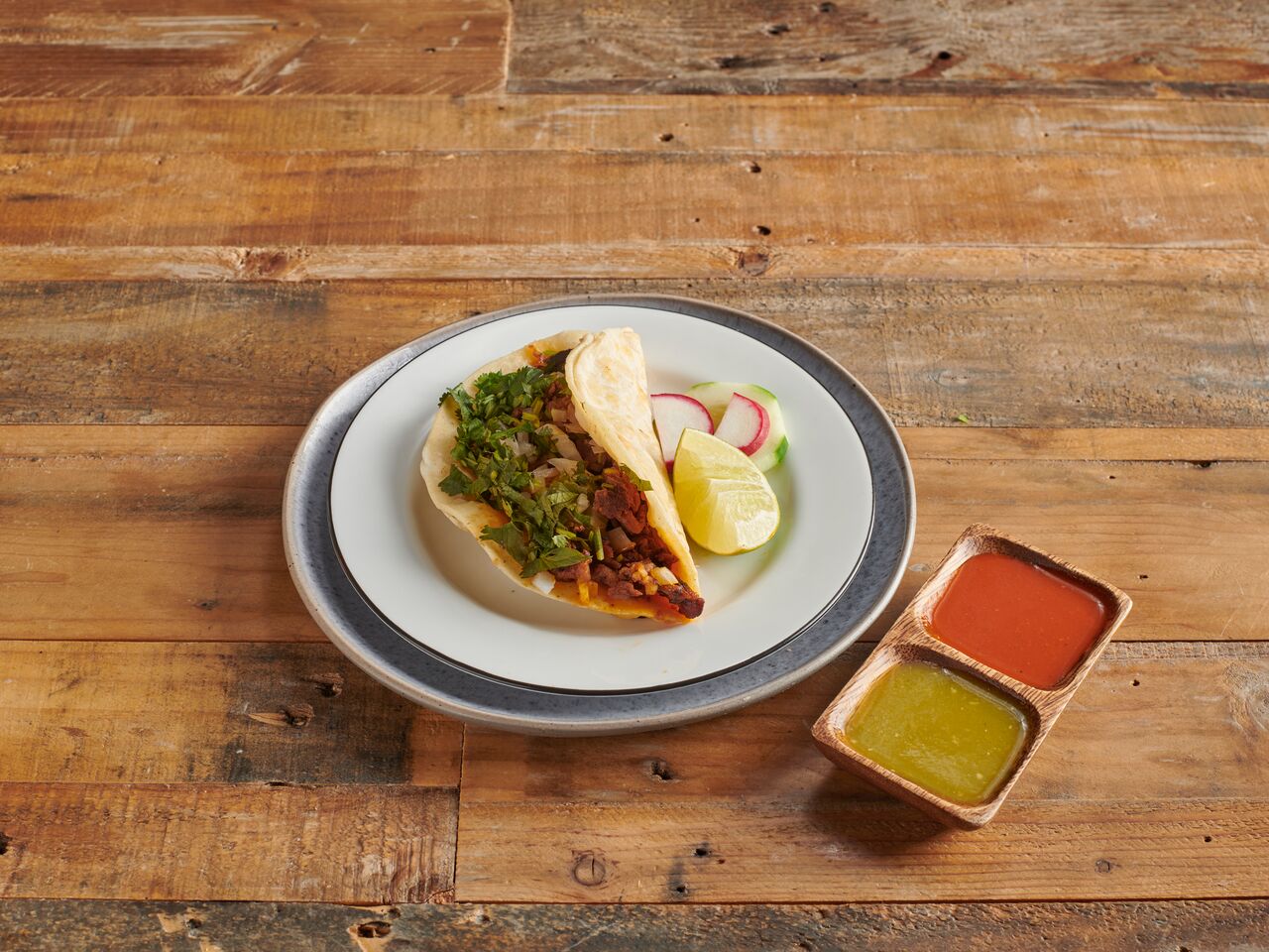 Order Al Pastor Taco with Cilantro and Onions food online from Pablito's Taqueria store, Brooklyn on bringmethat.com