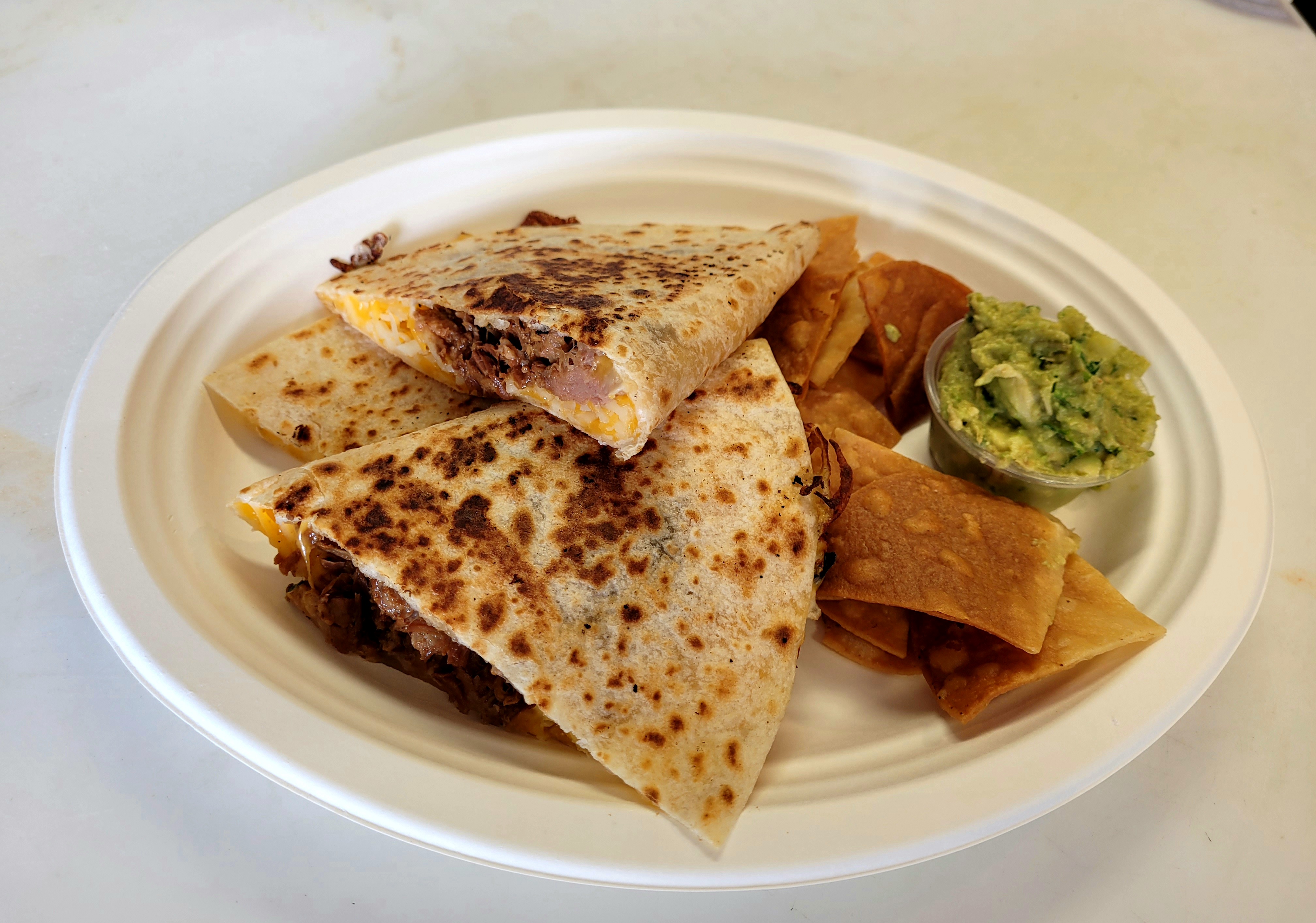 Order Carnitas Quesadilla  food online from Rasta Taco store, Laguna Beach on bringmethat.com
