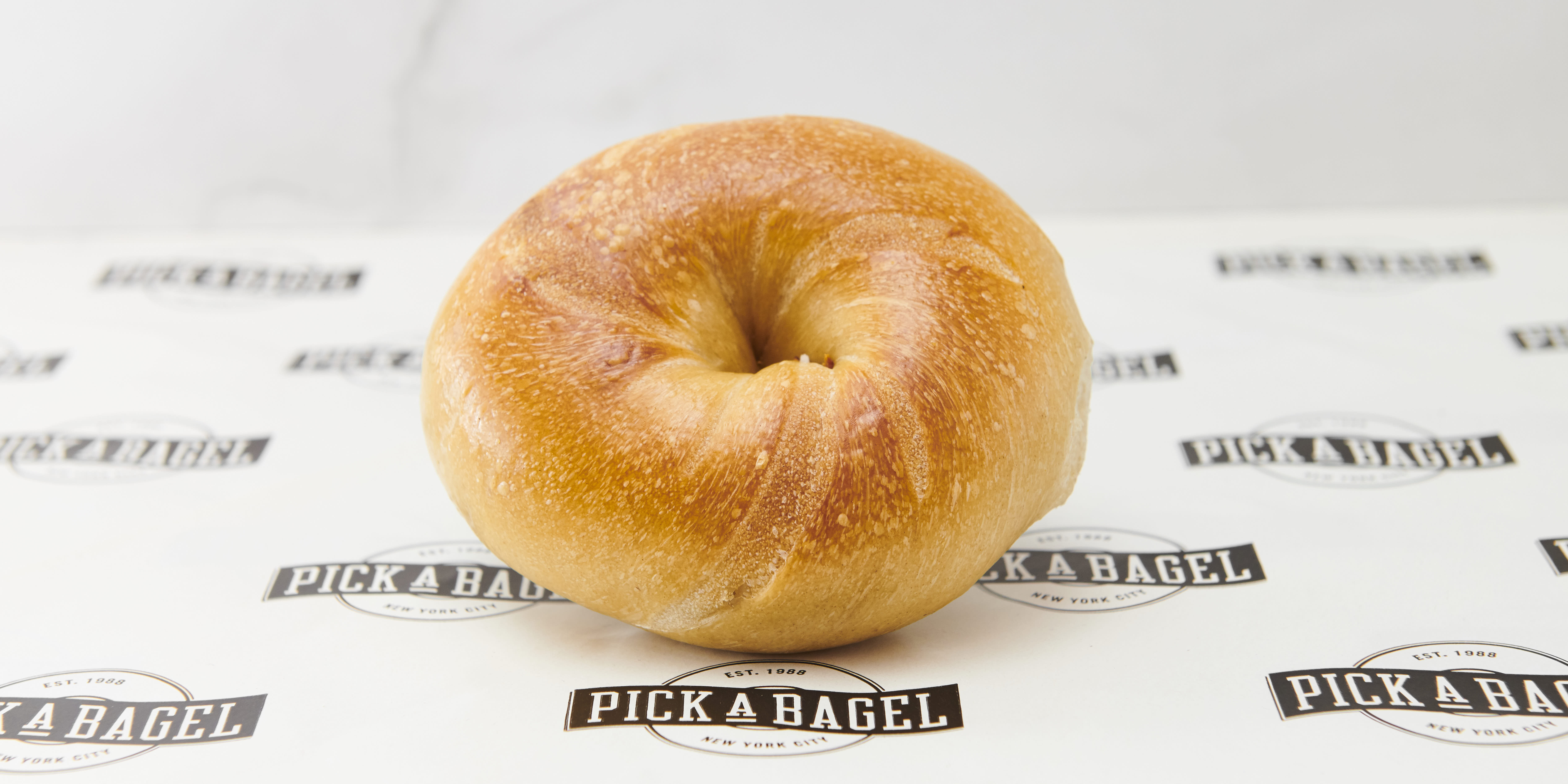 Order Buttered Bagel food online from Pick a Bagel store, New York on bringmethat.com
