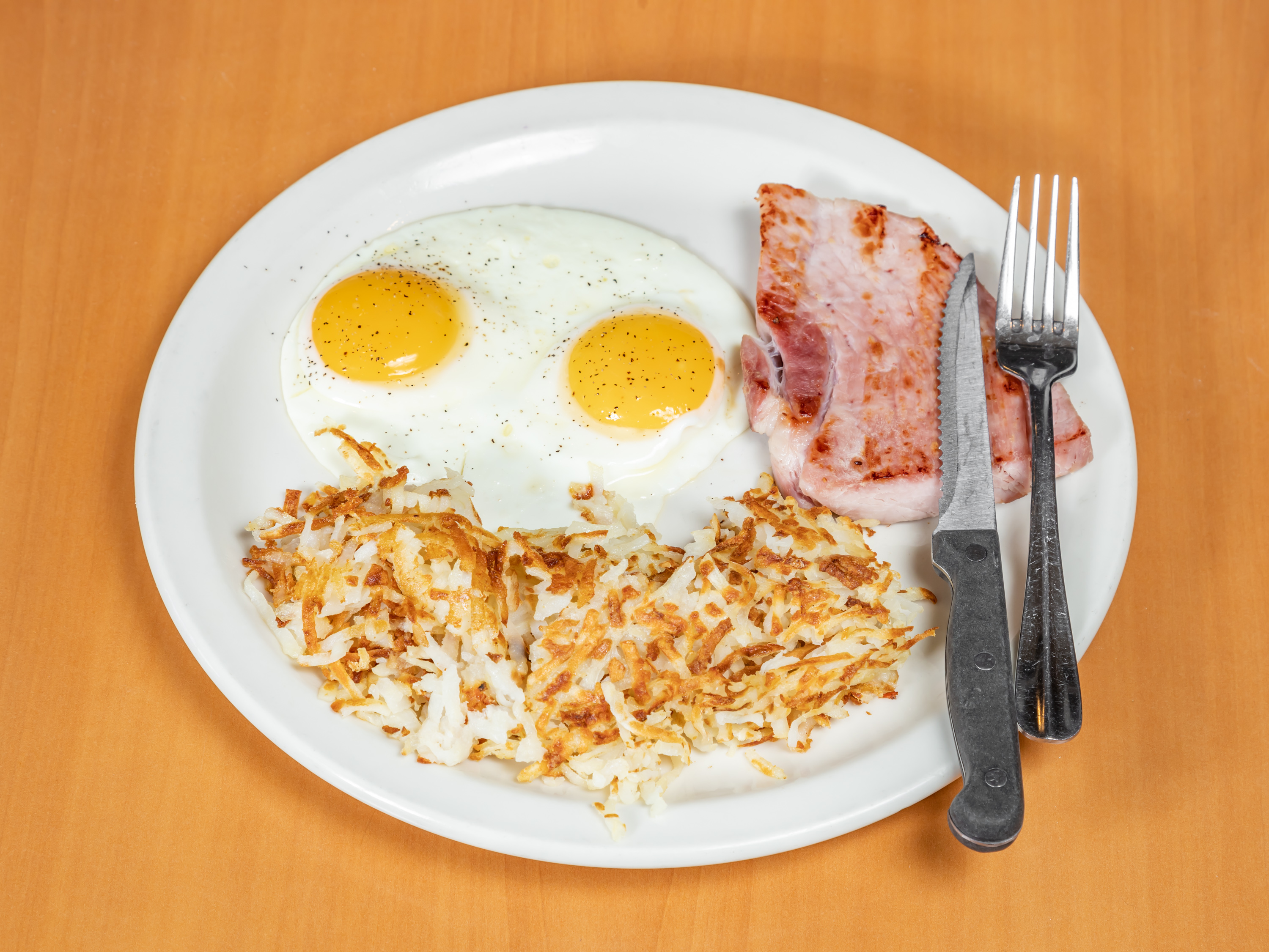 Order 2 Eggs with Hickory Smoked Ham Off the Bone food online from Apple Villa Pancake House store, Batavia on bringmethat.com