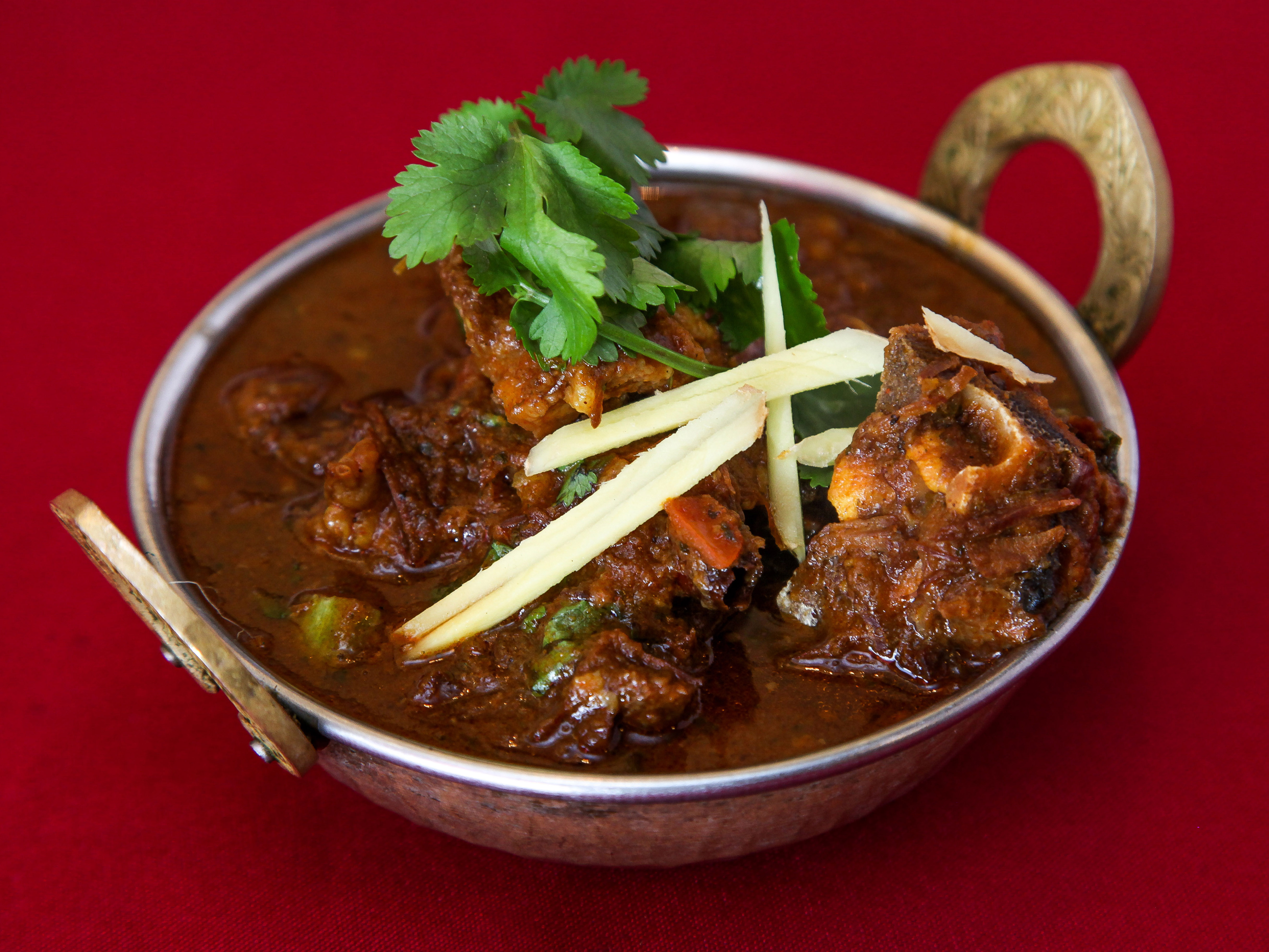 Order Goat Curry food online from Great Indian Cuisine store, Santa Clara on bringmethat.com