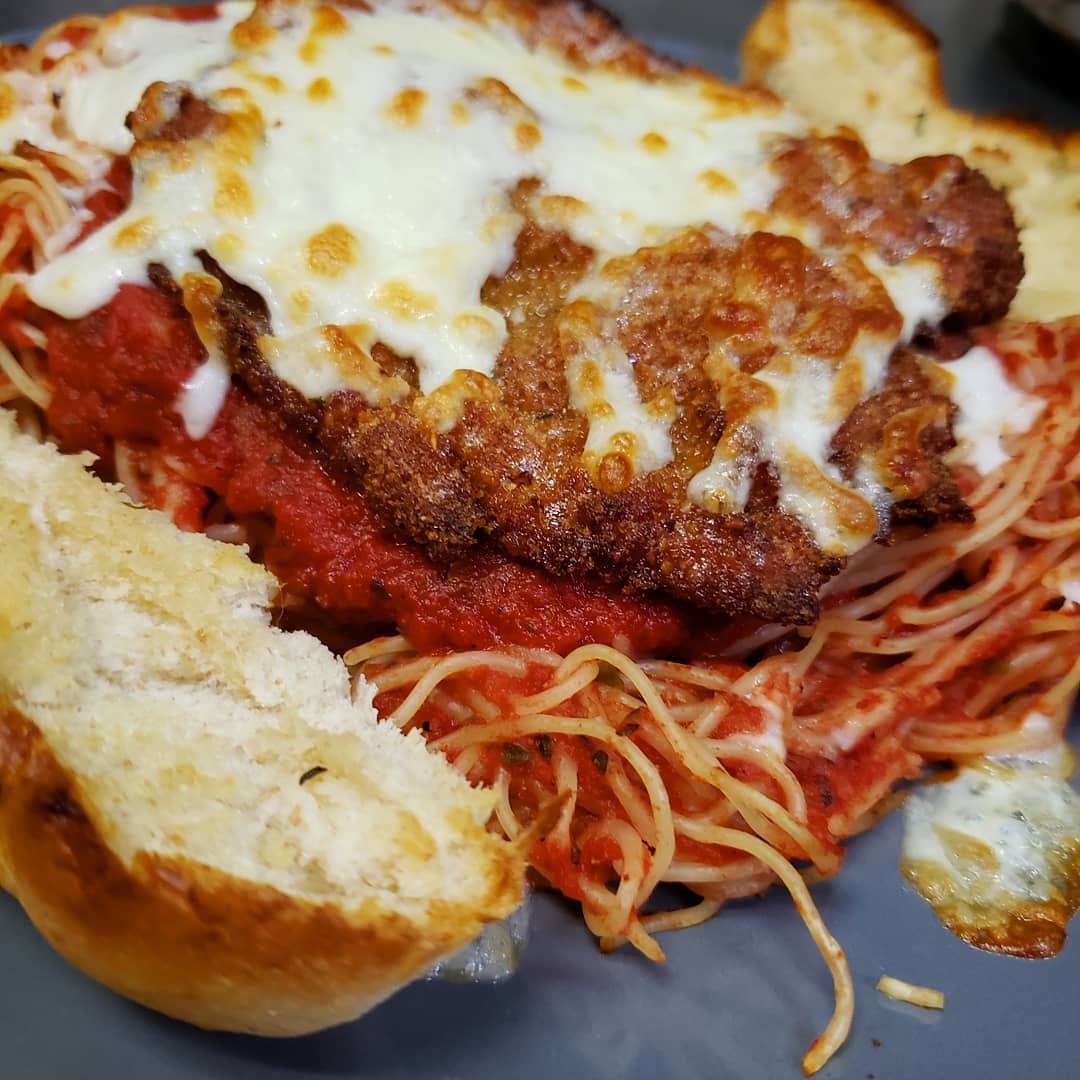 Order Chicken Parmesan - Dinner food online from Holiday Pizza store, Statesboro on bringmethat.com