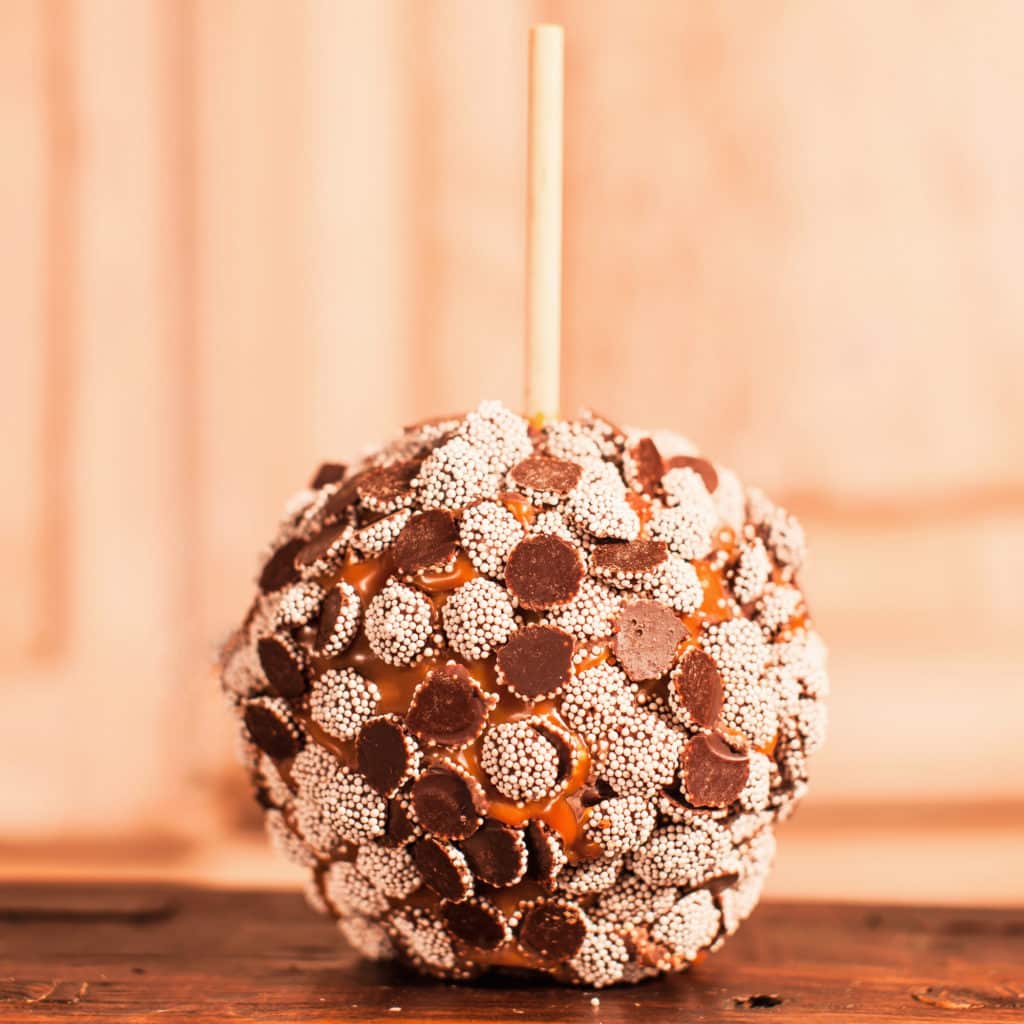 Order Dark Chocolate Nonpareils Caramel Apple food online from Candy Apple Shoppe store, Glenwood on bringmethat.com
