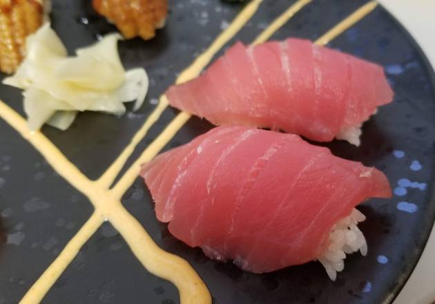 Order Tuna Sushi Nigiri 2pcs food online from Koko Teriyaki store, Dupont on bringmethat.com