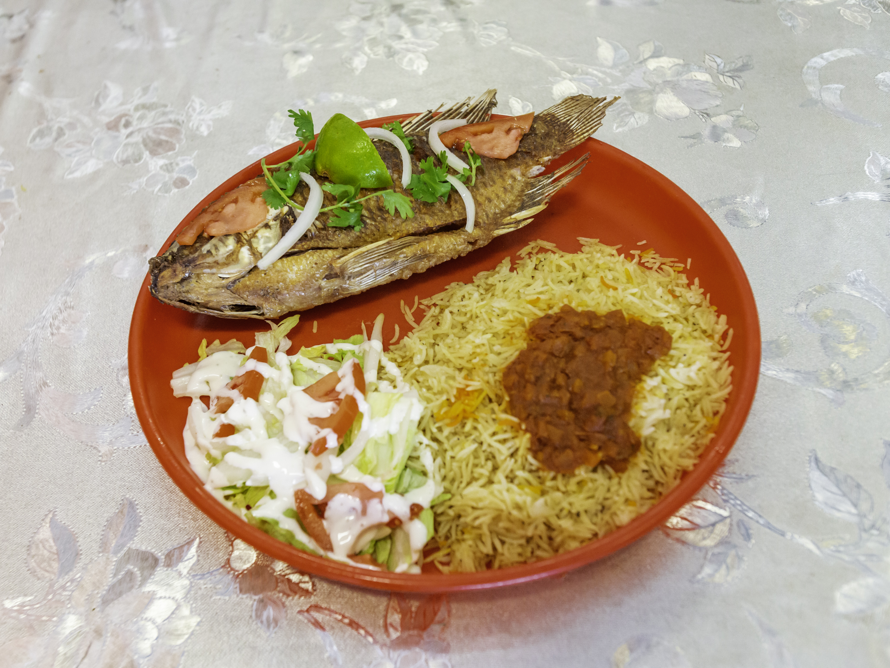 Order Rice with Tilapia Plate food online from International Cafe store, Omaha on bringmethat.com