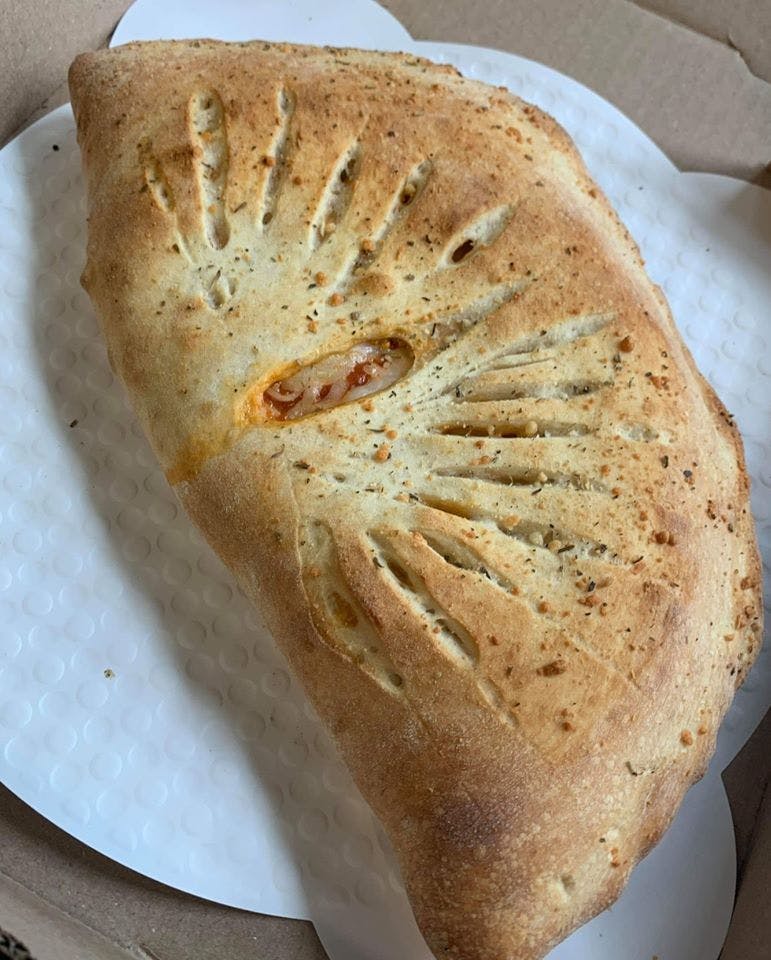 Order Calzone - Calzone food online from Novotny's Groceries & Pizza store, Worthington on bringmethat.com