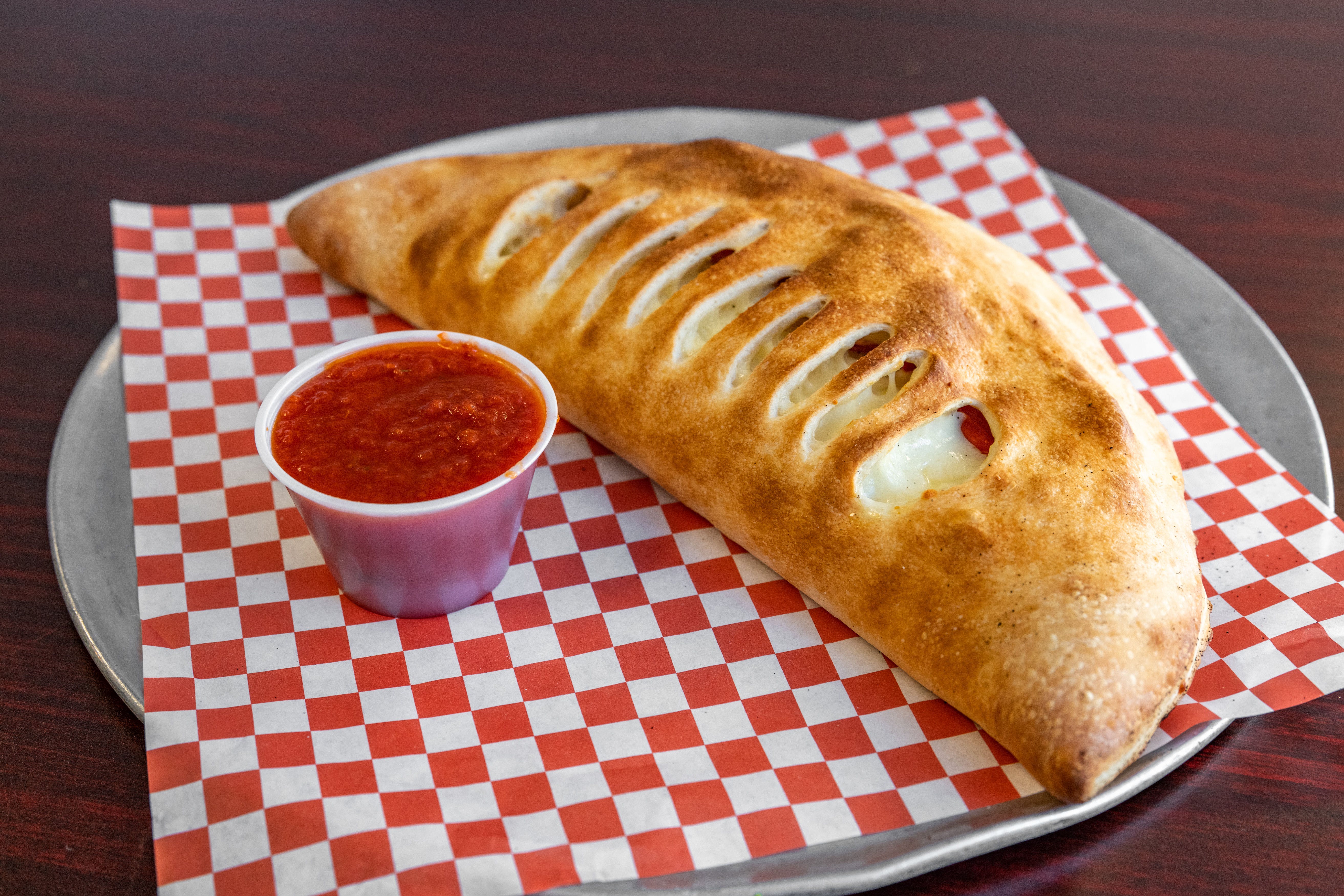 Order Classic Cheese Calzone - Calzone food online from East Side Pizza store, Lantana on bringmethat.com