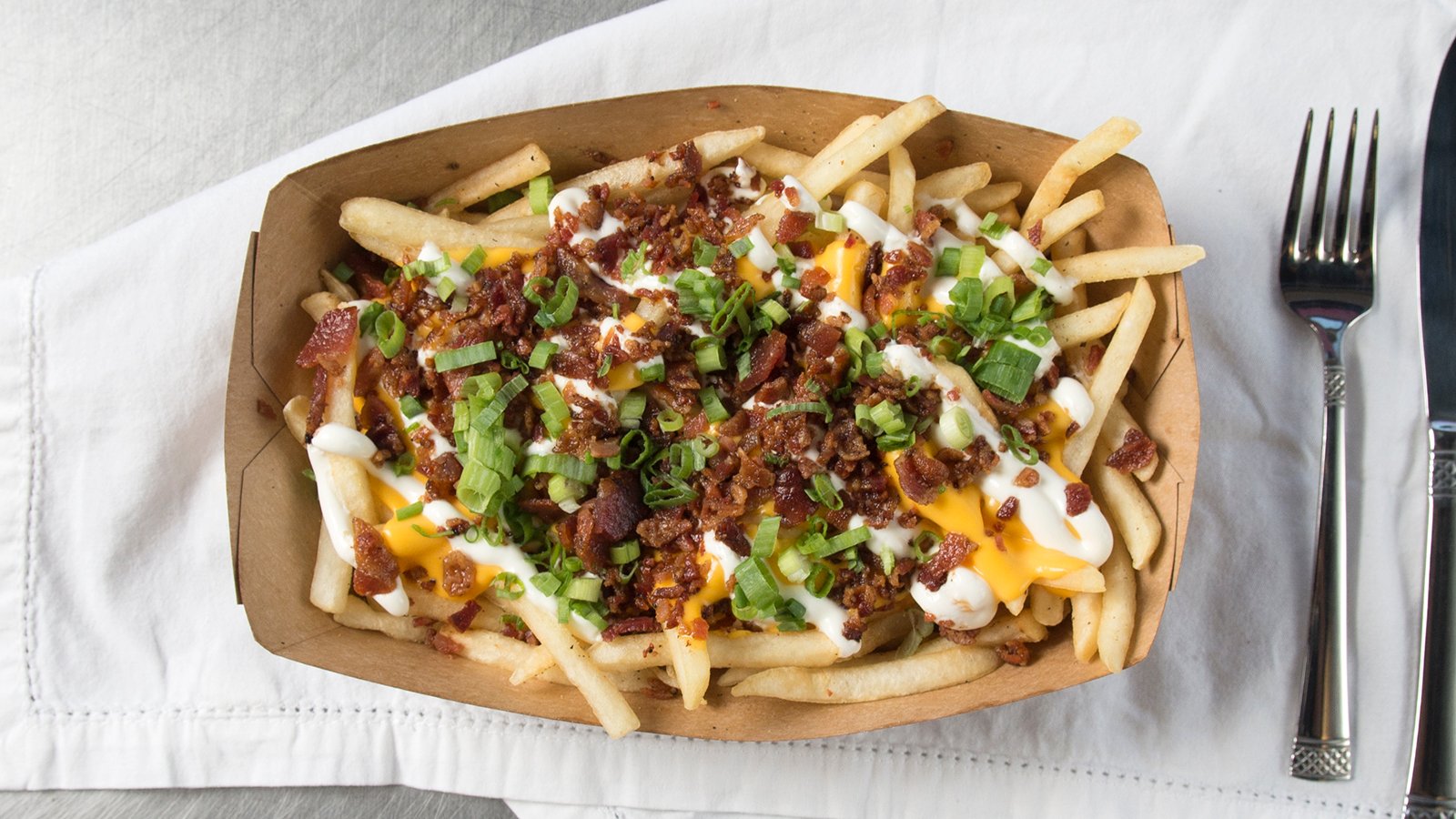 Order BAKED POTATO FRIES food online from Burros & Fries store, National City on bringmethat.com