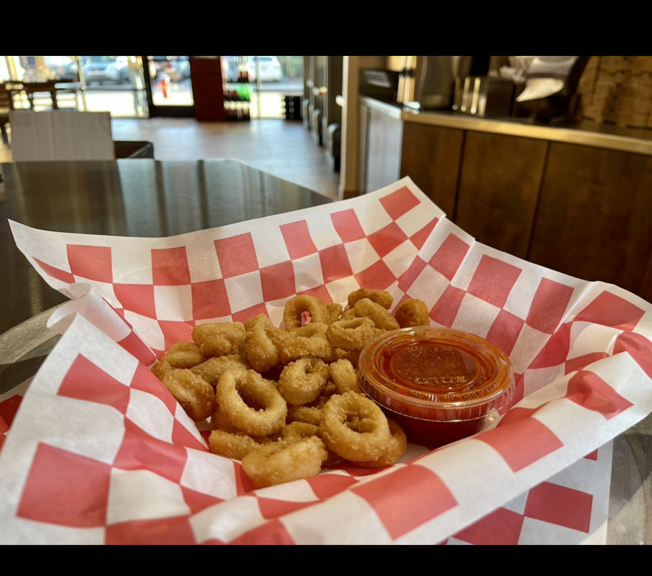 Order Fried Calamari food online from Johnny's Pizza store, Cary on bringmethat.com
