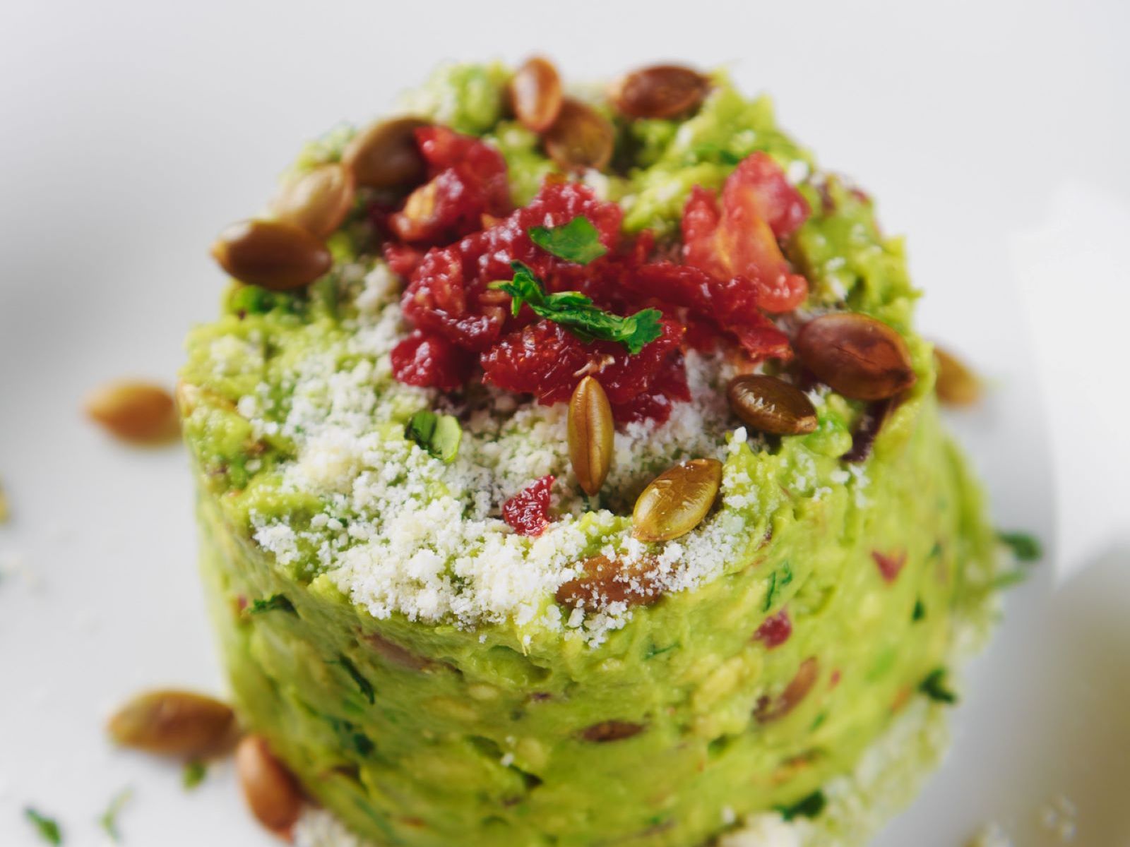 Order Sun Dried Tomato Guacamole food online from Antigua Latin Inspired Kitchen store, Milwaukee on bringmethat.com