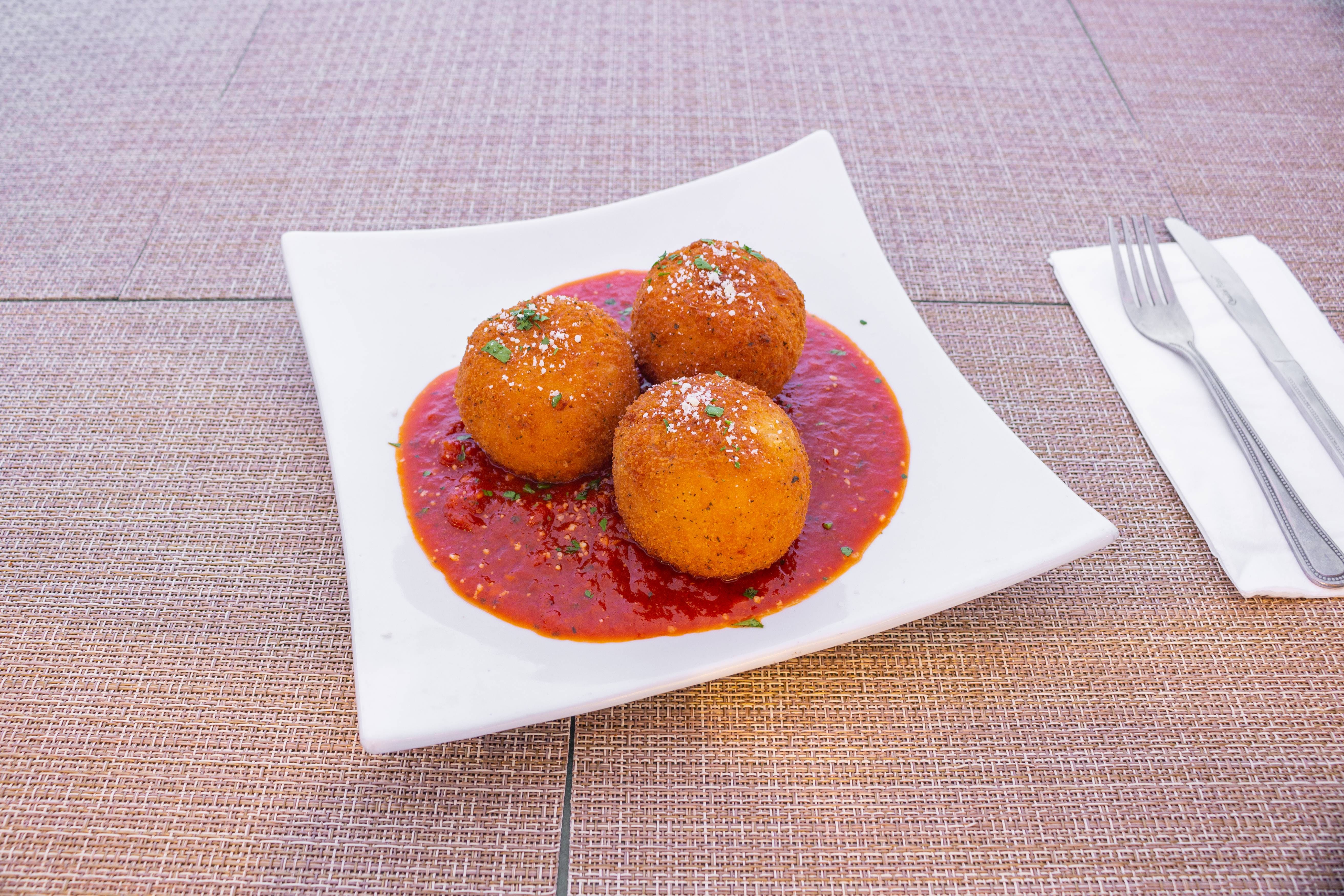 Order Risotto Balls - Appetizer food online from Pizza Man Trattoria Italiano store, Pompton Plains on bringmethat.com
