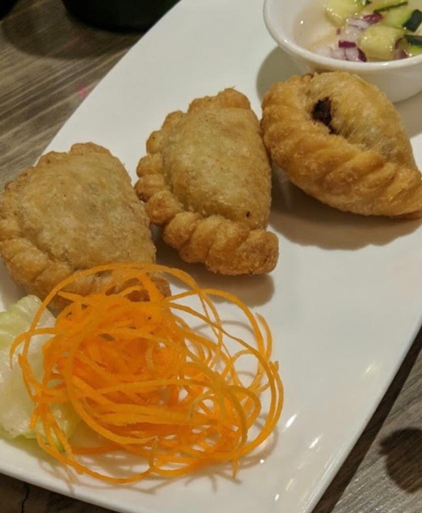 Order 2. Curry Puff food online from Thai V Express store, New York on bringmethat.com