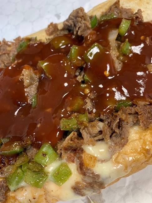 Order (12oz) Mumbo Philly cheesesteak with peppers onions and a generous amount of Mumbo sauce (12oz of meat on a Amoroso roll ) food online from From Philly To Charlit store, Charlotte on bringmethat.com