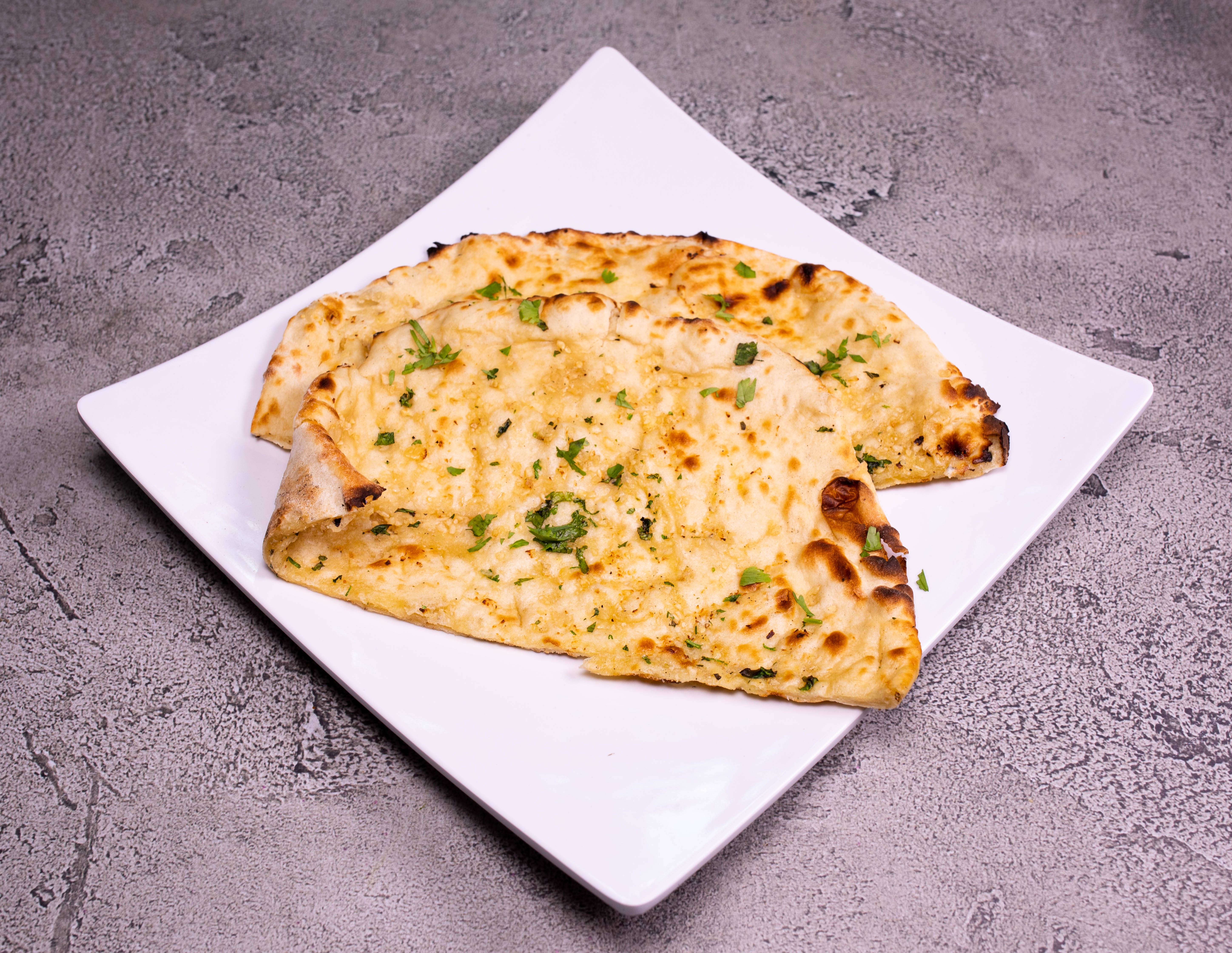 Order Chili Naan food online from Sitar Indian Cuisine store, Huntsville on bringmethat.com