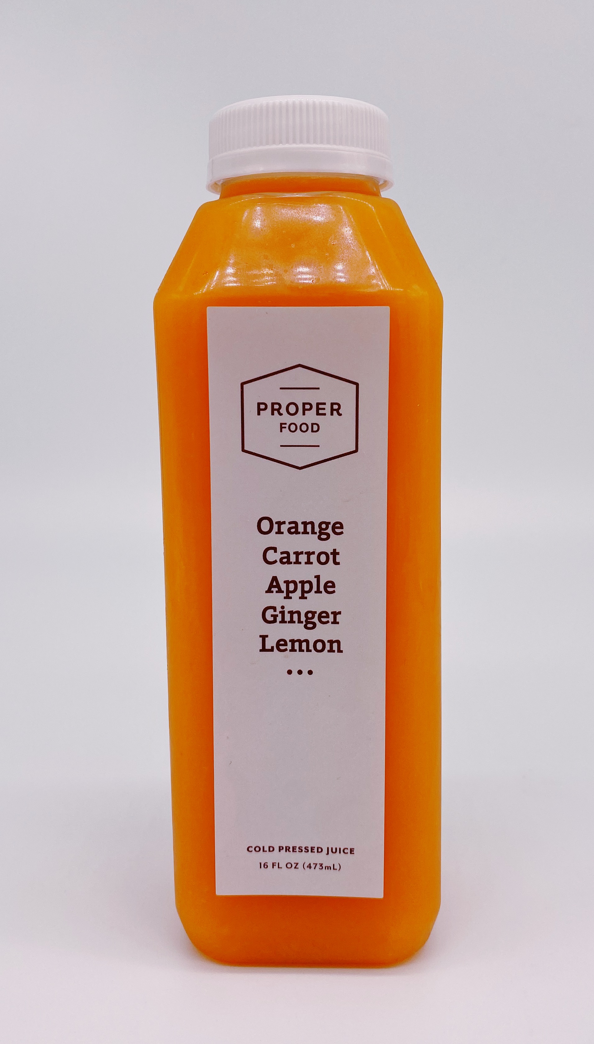 Order 16 oz. Orange Carrot Apple Ginger Juice food online from Proper Food store, New York on bringmethat.com