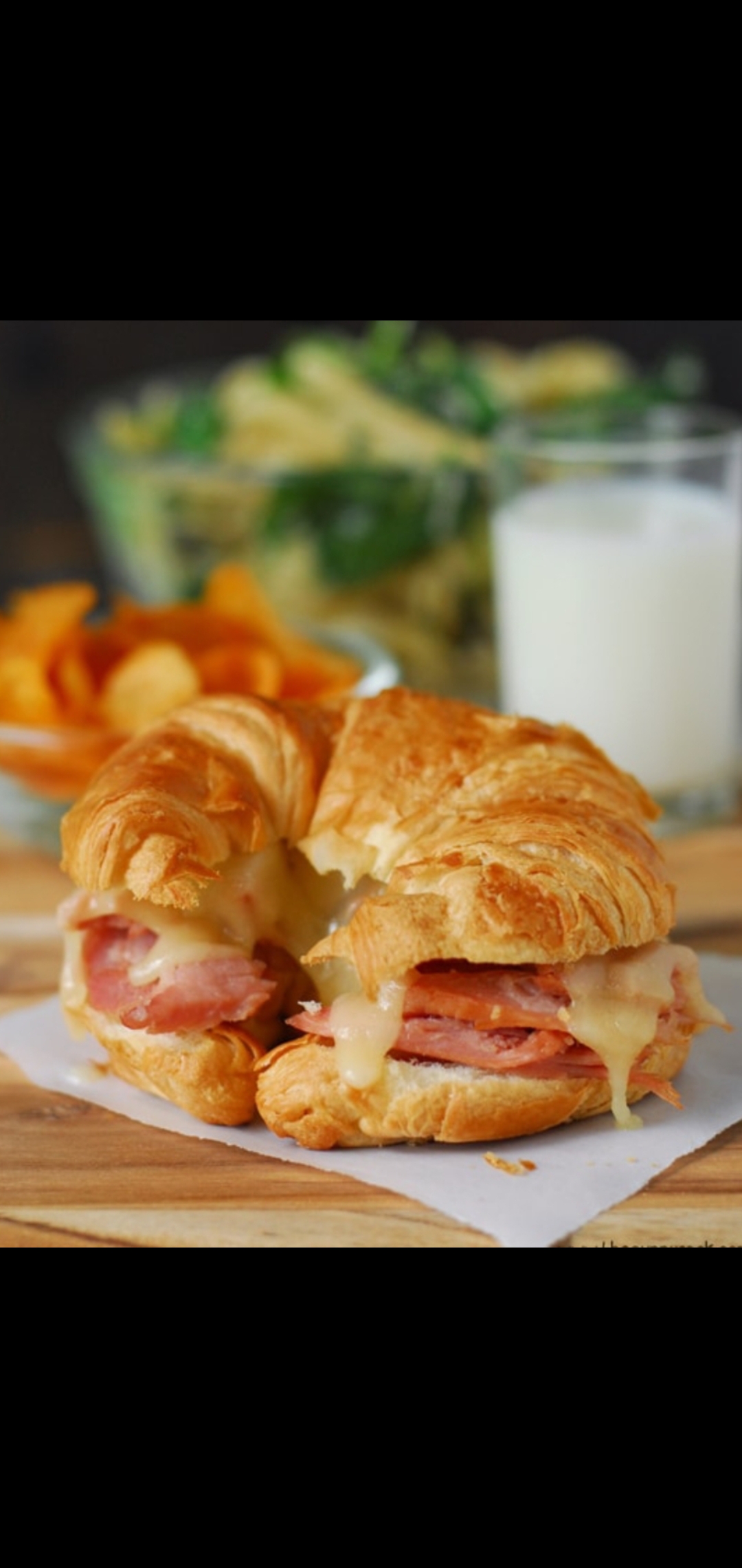 Order Ham Tomatoes &  Melted Cheese Breakfast Croissant Sandwich  food online from American Gourmet Foods Deli store, New York on bringmethat.com