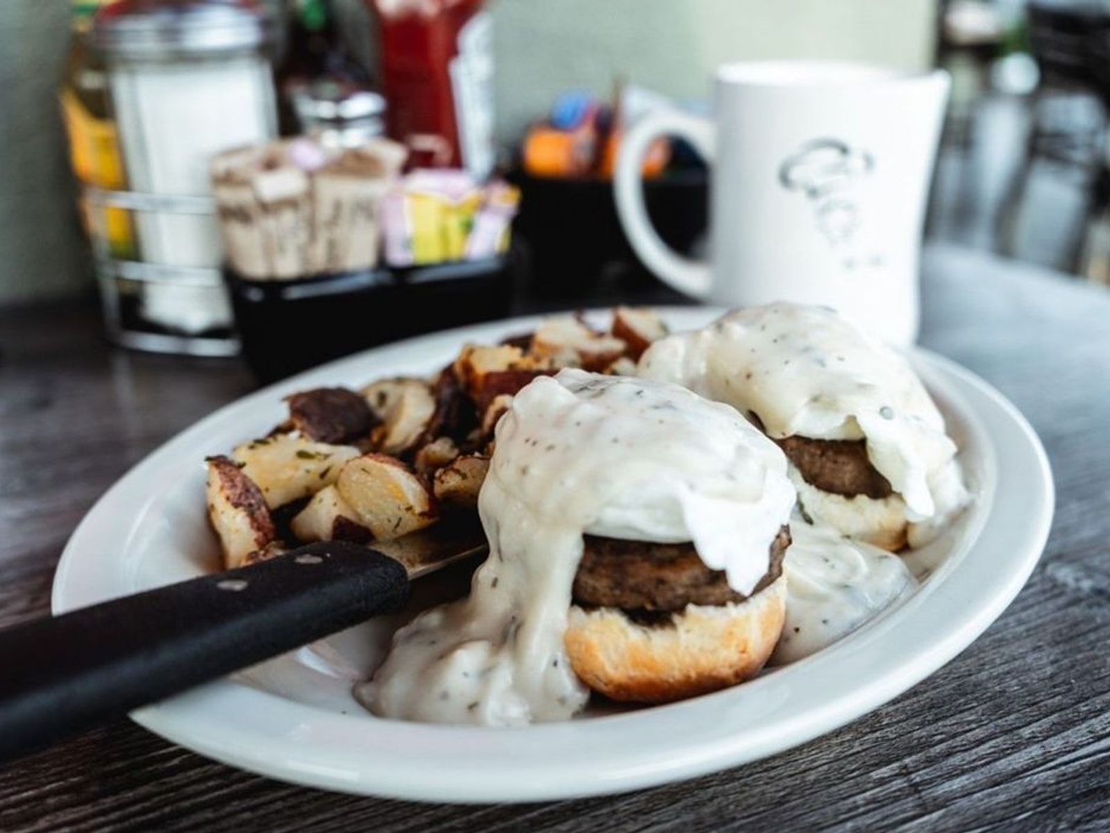 Order Country Benedict - OO food online from Biscuits Cafe store, Chandler on bringmethat.com