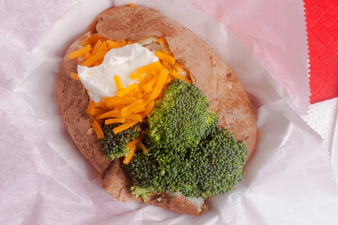 Order 11. Baked Potato with Broccoli, Butter, Cheddar or Jack, Sour Cream food online from Reddi Chick BBQ store, Santa Monica on bringmethat.com