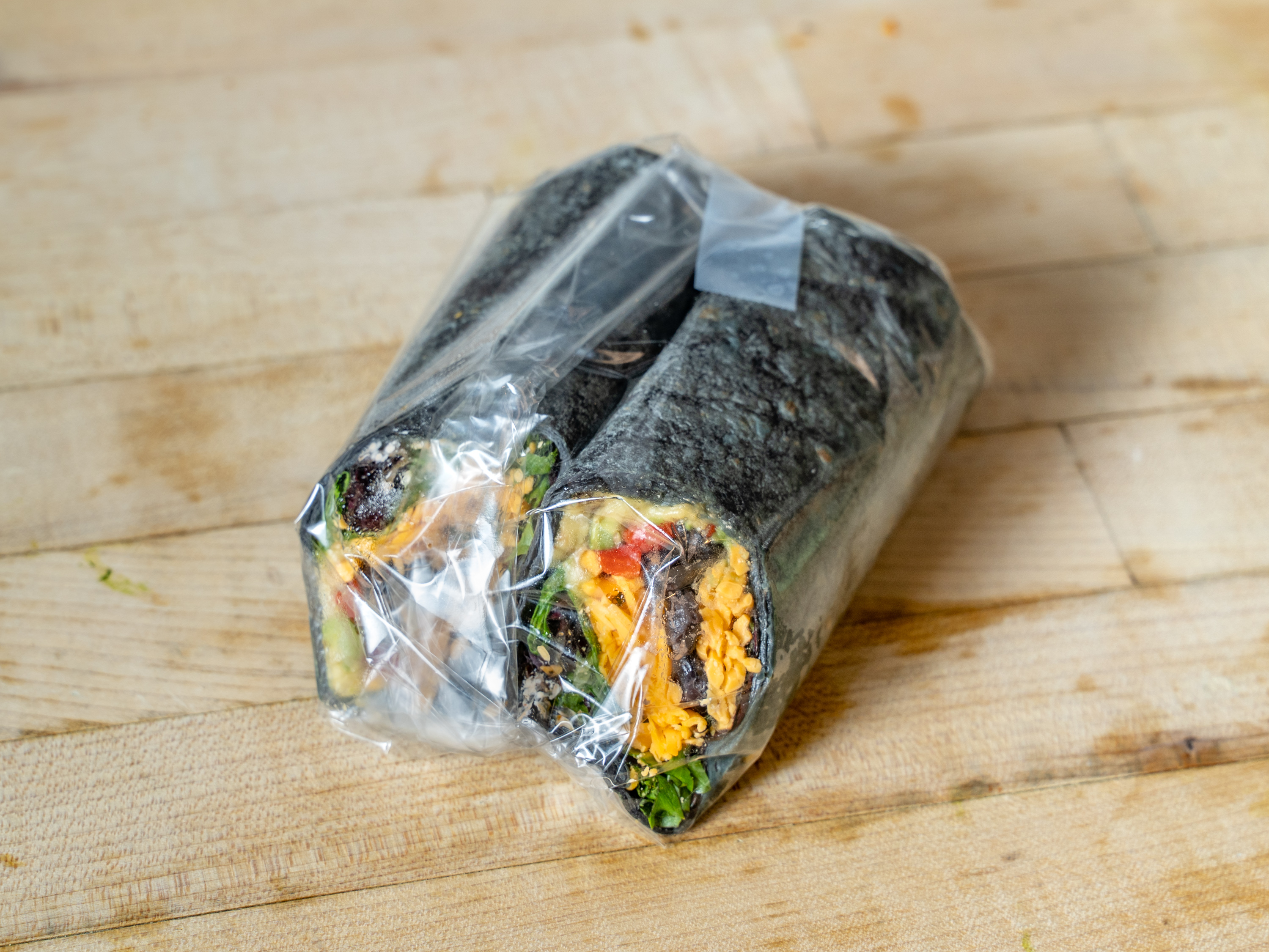 Order Avocado X Black Bean Wrap food online from Ready To Eat store, New York on bringmethat.com
