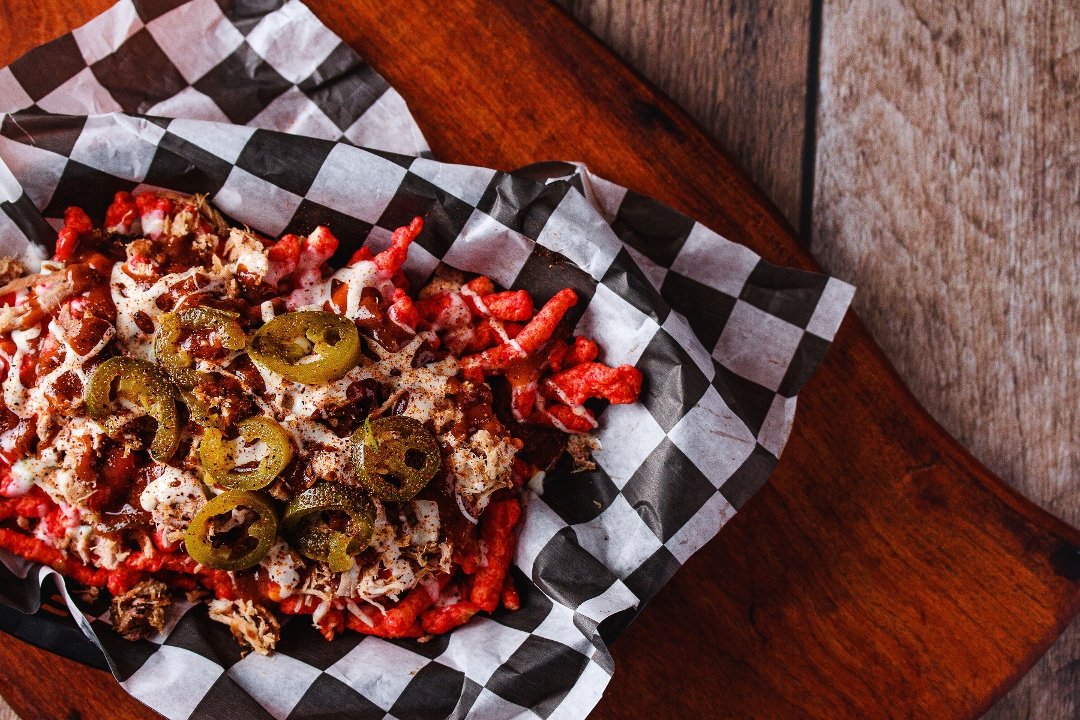 Order Flamin' Hot Cheetos Nachos food online from Tops Bar-B-Q store, Southaven on bringmethat.com
