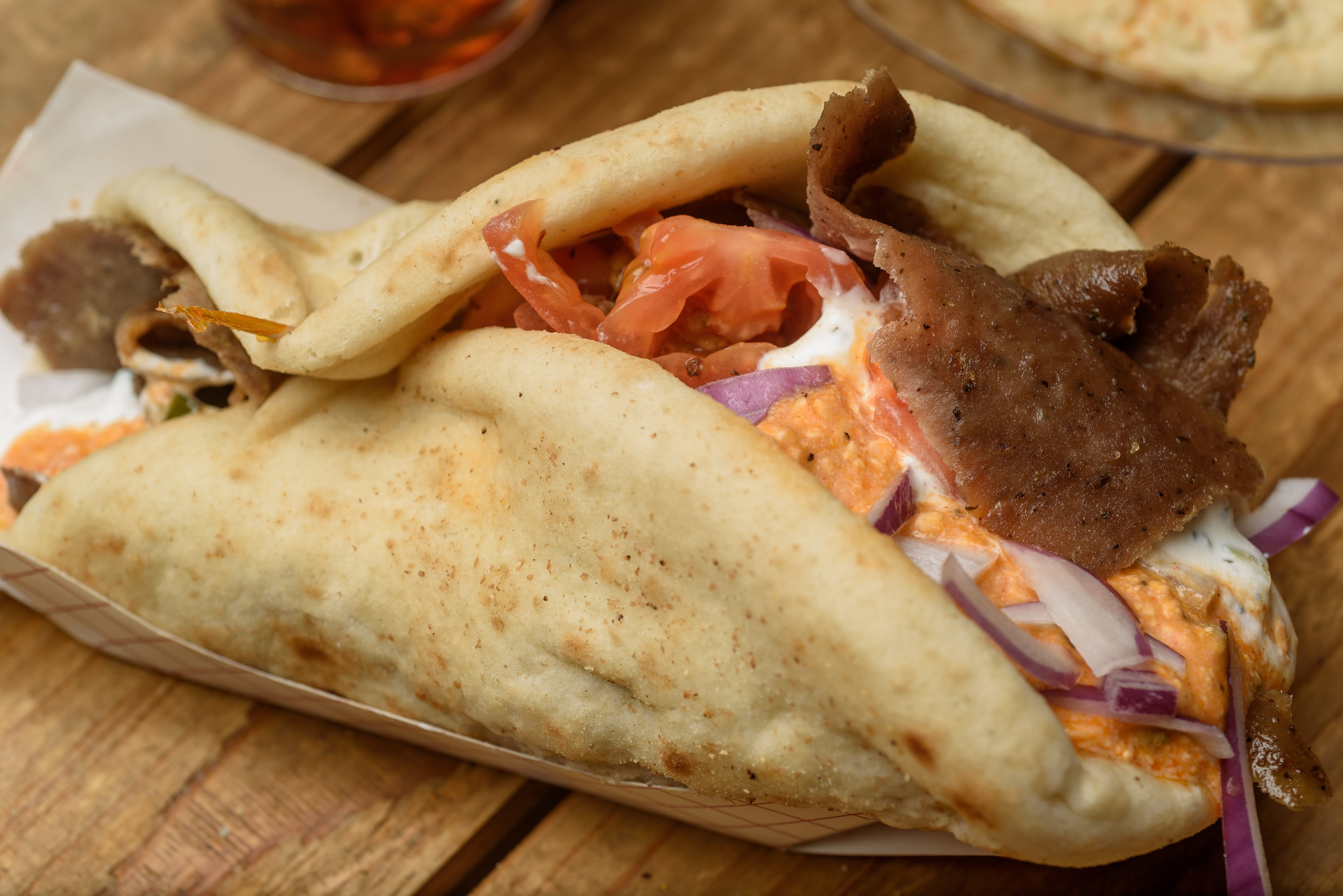 Order Feisty Gyro Pita Wrap food online from Zorbas store, Youngsville on bringmethat.com