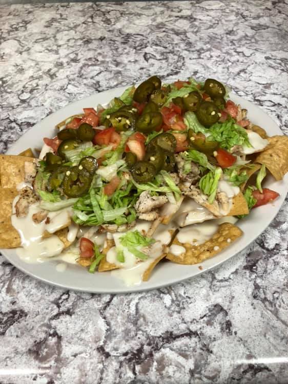 Order Reme's Nachos and Cheese food online from Reme Restaurant store, Plainfield on bringmethat.com