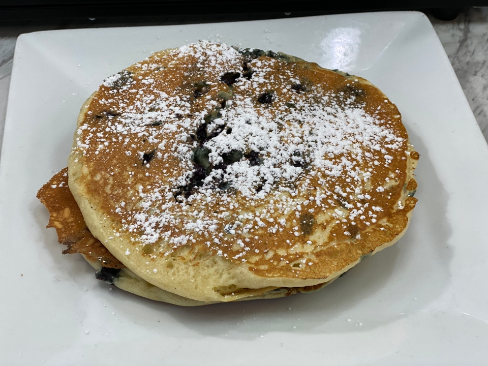 Order 2 BLUE BERRY BUTTERMILK PANCAKES food online from Meeting Street Cafe store, Providence on bringmethat.com